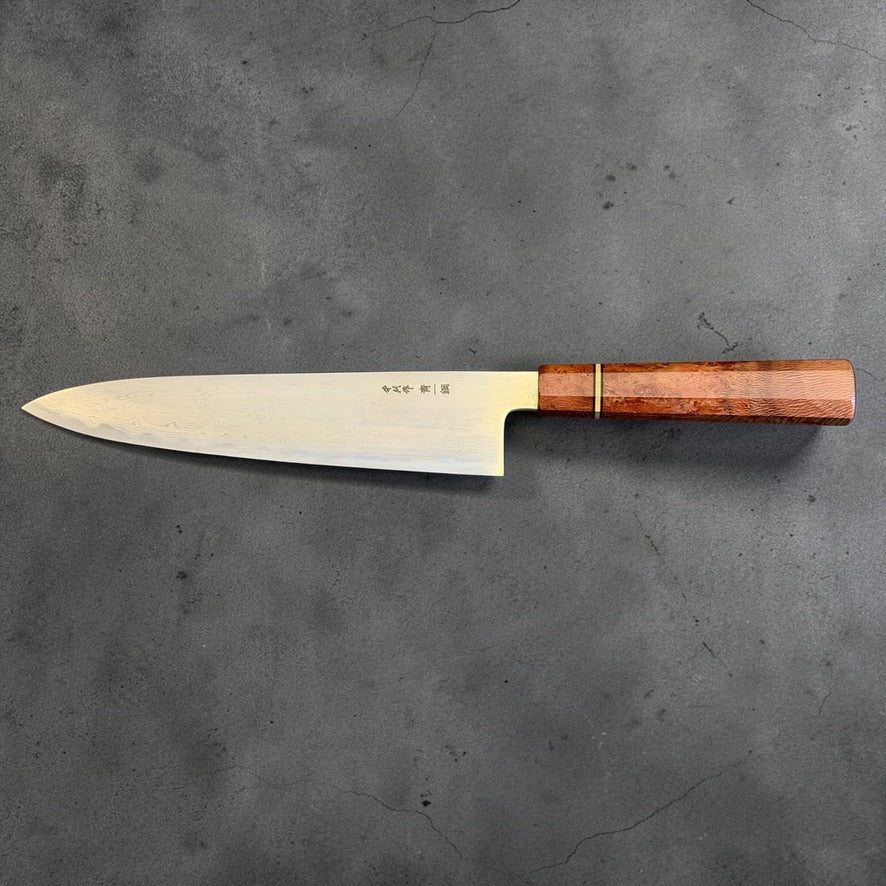 Satoshi Nakagawa Blue #1 Damascus Gyuto 240mm with one-of-one reddish Prisma wa handle, full side view.