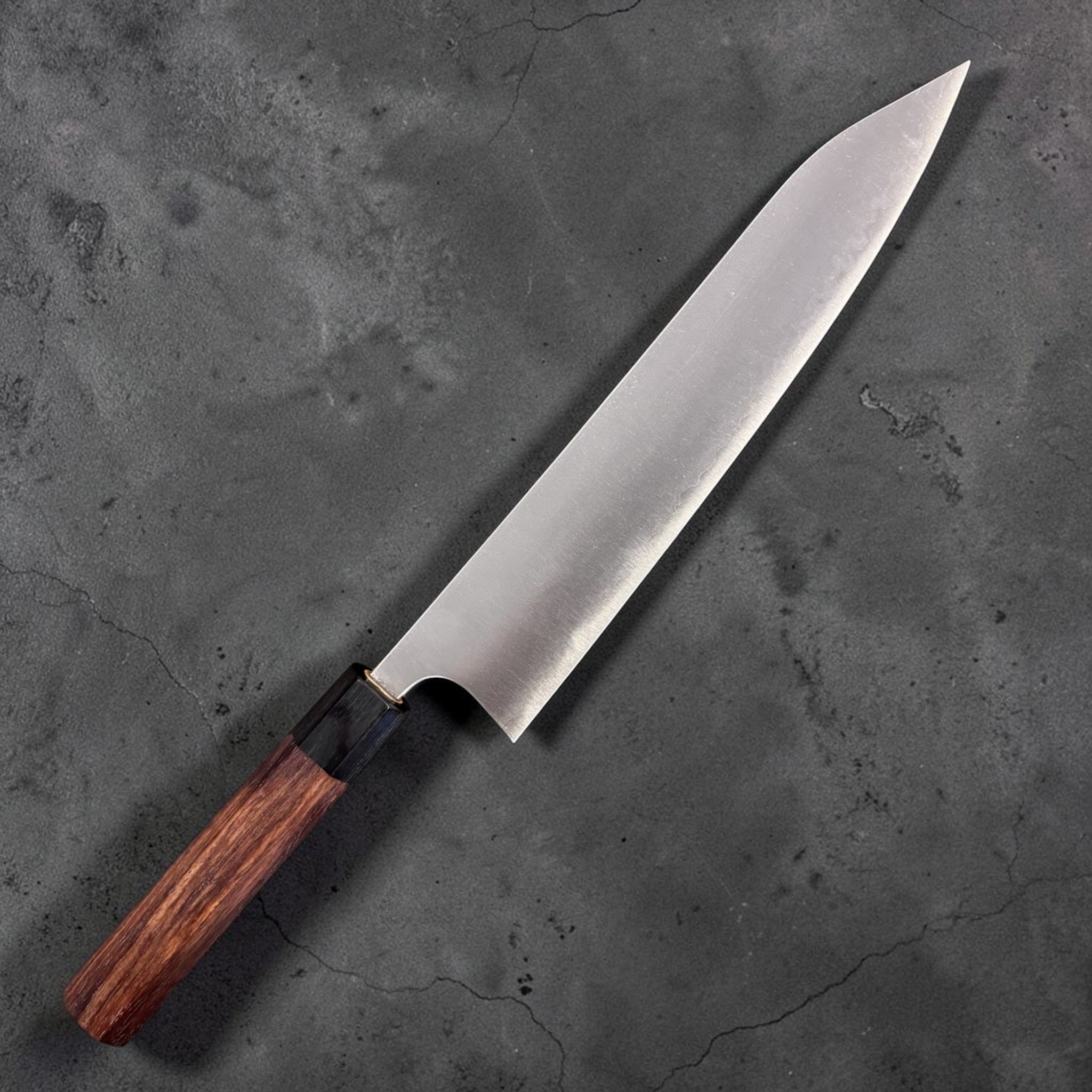Shibata Koutetsu Aogami Super Gyuto 240 mm, spine thickness view toward the tip on a white background.