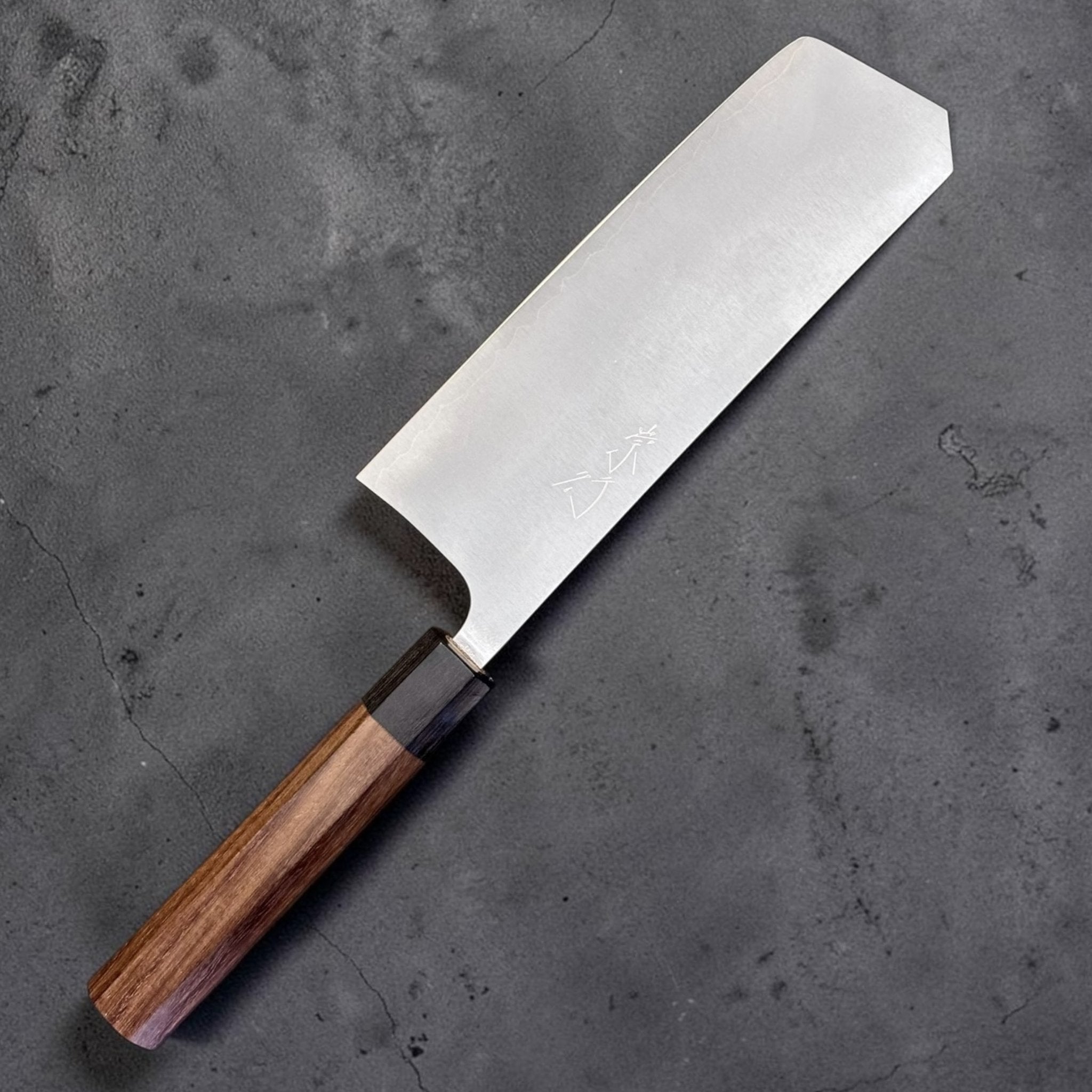 Shibata Koutetsu Chromax Boss Nakiri, angled view showing the blade face, kanji engraving, and octagonal wa handle.