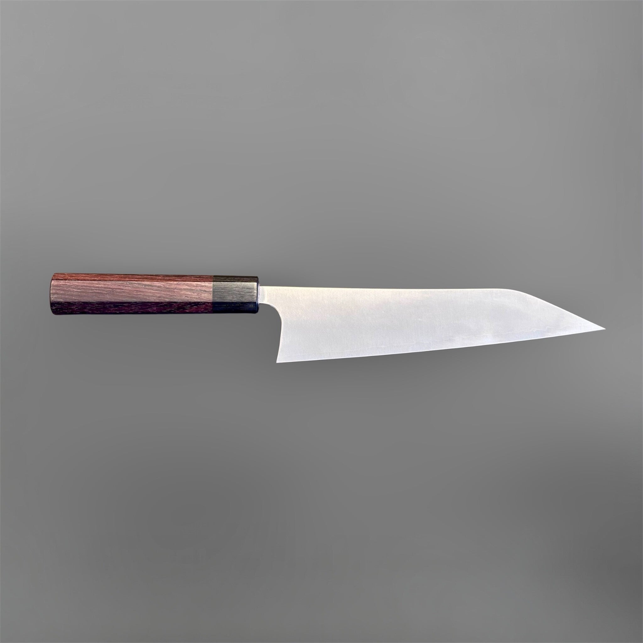Shibata Koutetsu Chromax Gyuto 210 mm with rosewood octagon handle, full right-facing profile on gray background.