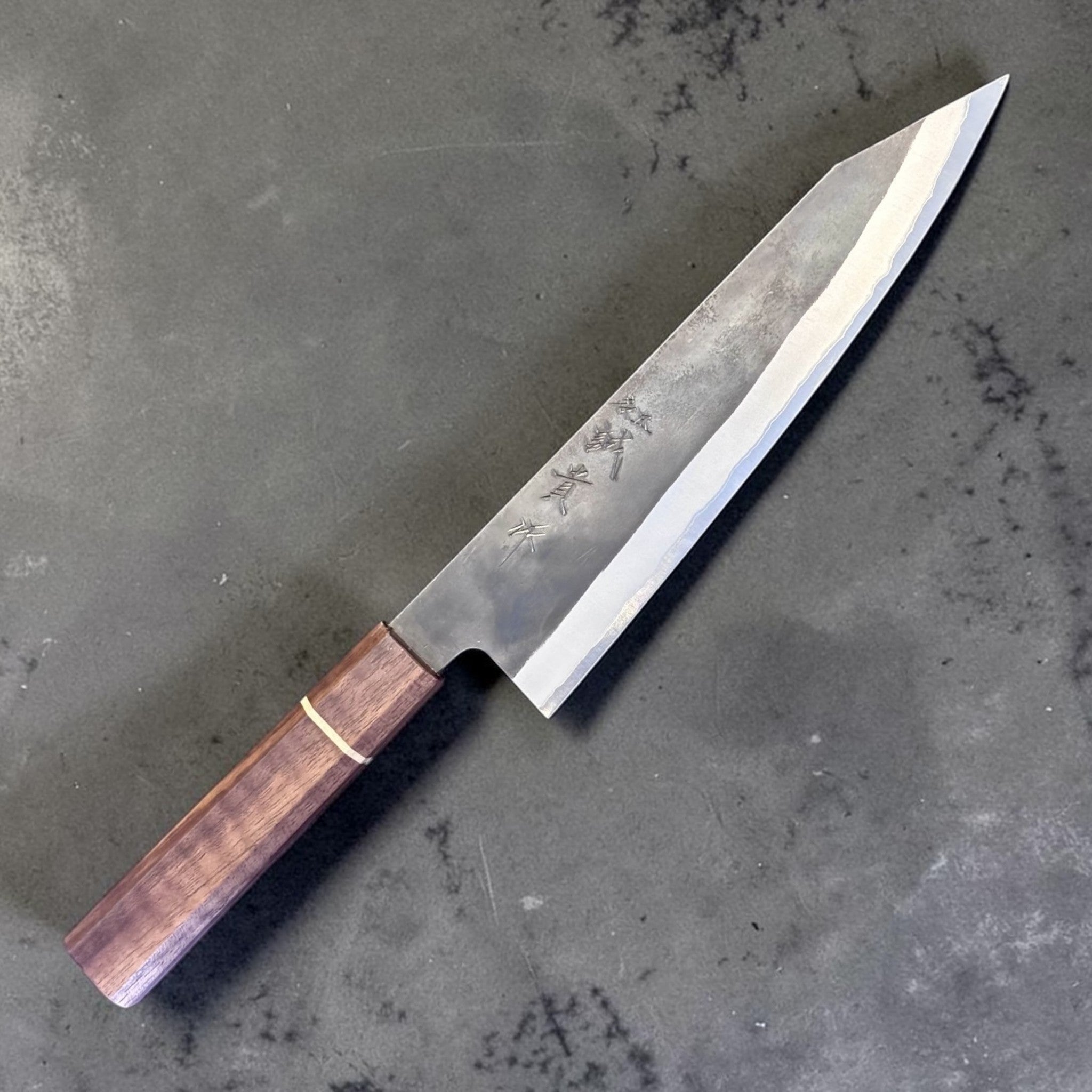 Shigeki Tanaka Stainless-Clad Blue #2 Kurouchi Kiritsuke 210 mm, diagonal product view highlighting the kiritsuke tip.