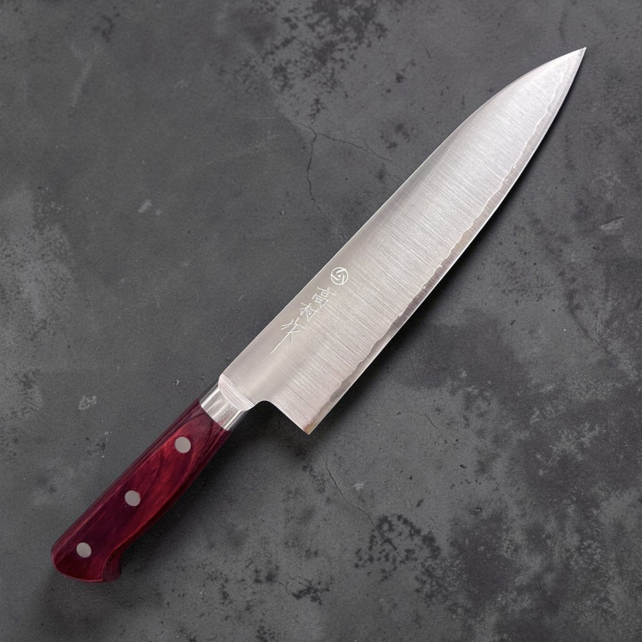 Takamura SG2 Gyuto 180 mm, right-side face showing grind and brushed finish; red Western handle.