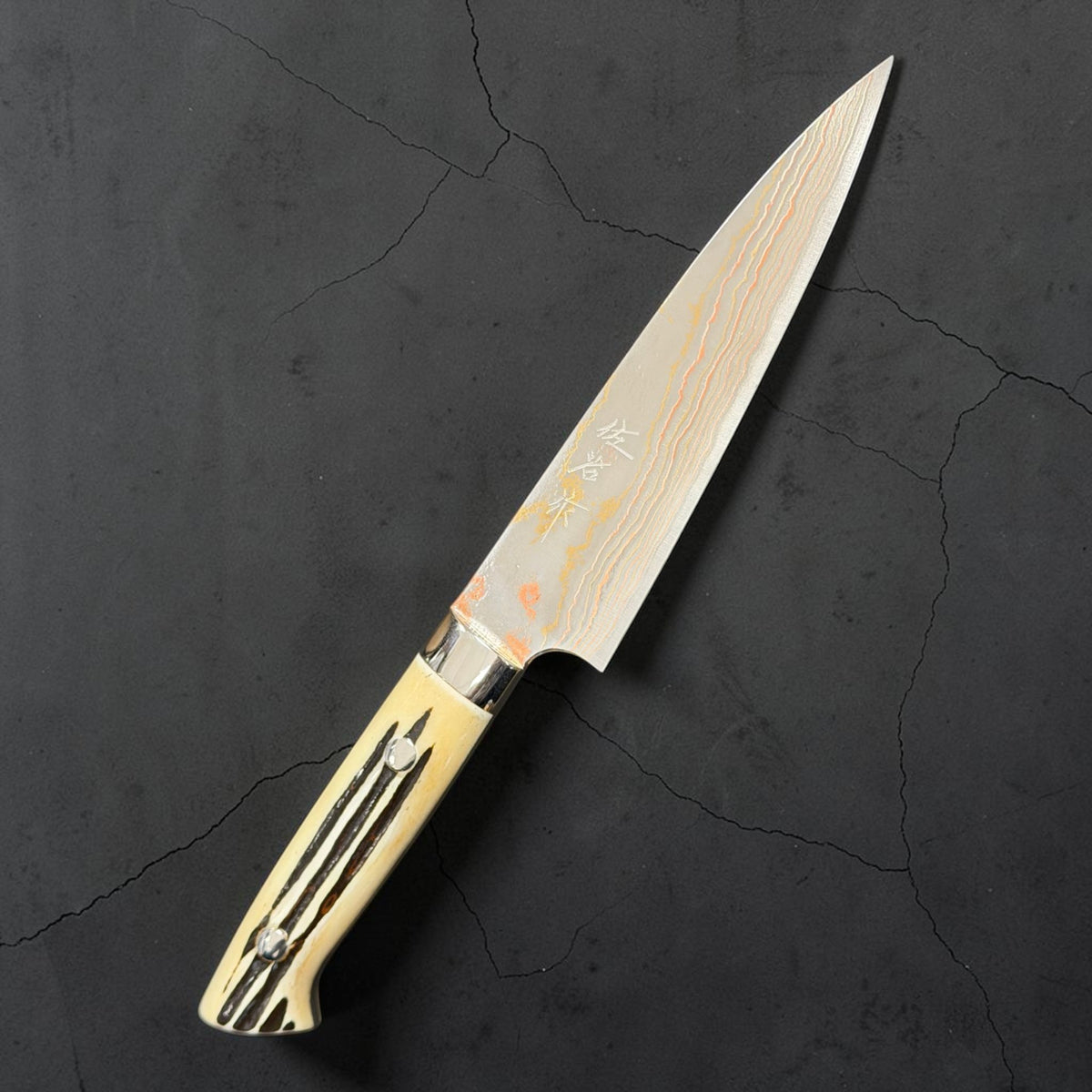 Hero of Takeshi Saji Blue #2 Rainbow Damascus Petty 130mm with white cow-horn western handle.