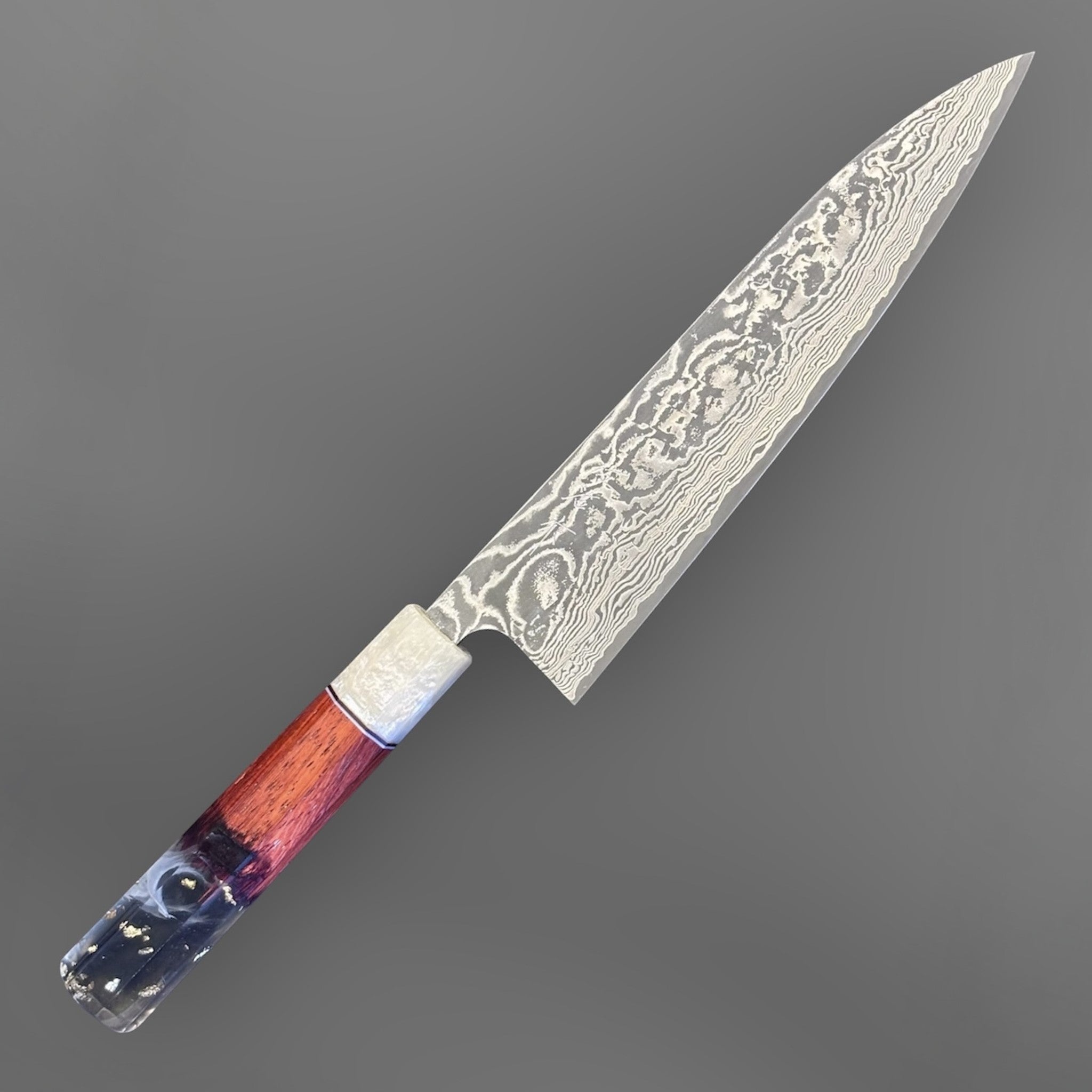 Takeshi Saji SG2 Kuro Damascus Gyuto 210 mm with Prisma Knife Handle, angled full-profile product photo showing the kuro damascus blade and custom Prisma handle.