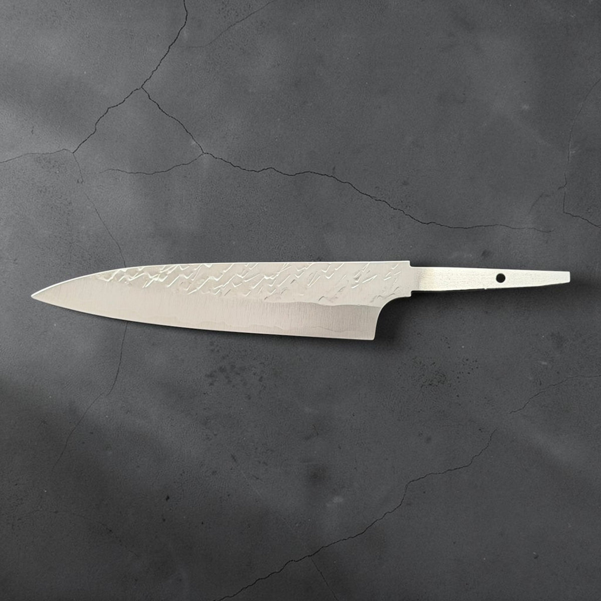Full reverse profile of Takeshi Saji STRIX Tsuchime Petty 130mm blade only on charcoal concrete.