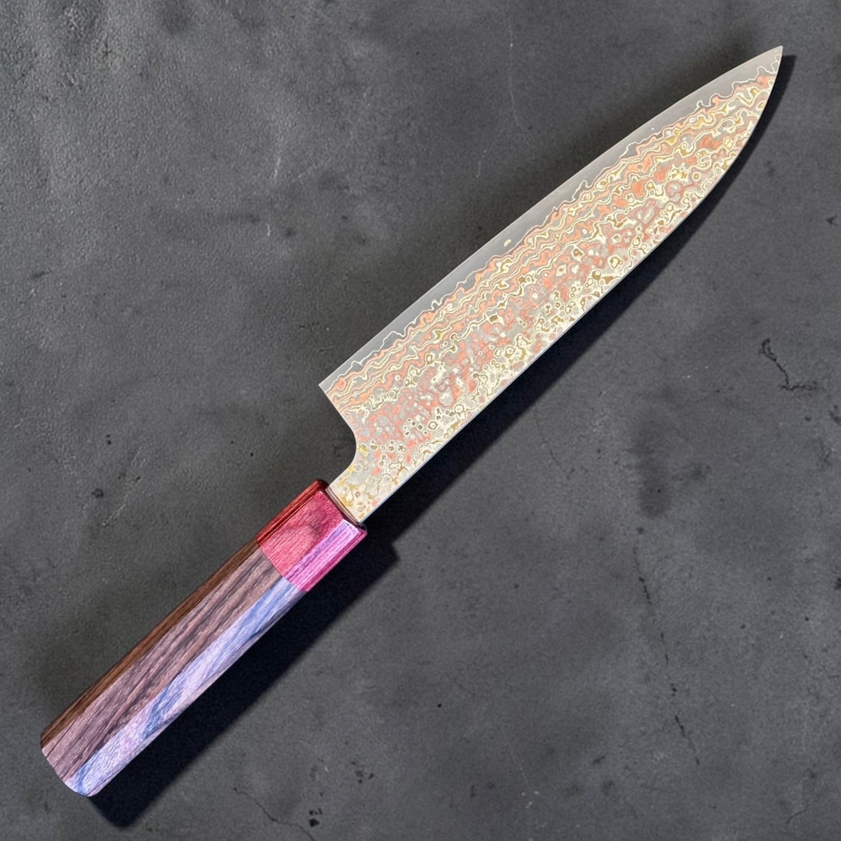 Takeshi Saji VG-10W Nashiji Rainbow Gyuto 180mm reverse angled view showing multimetal Damascus cladding and rosewood wa handle.