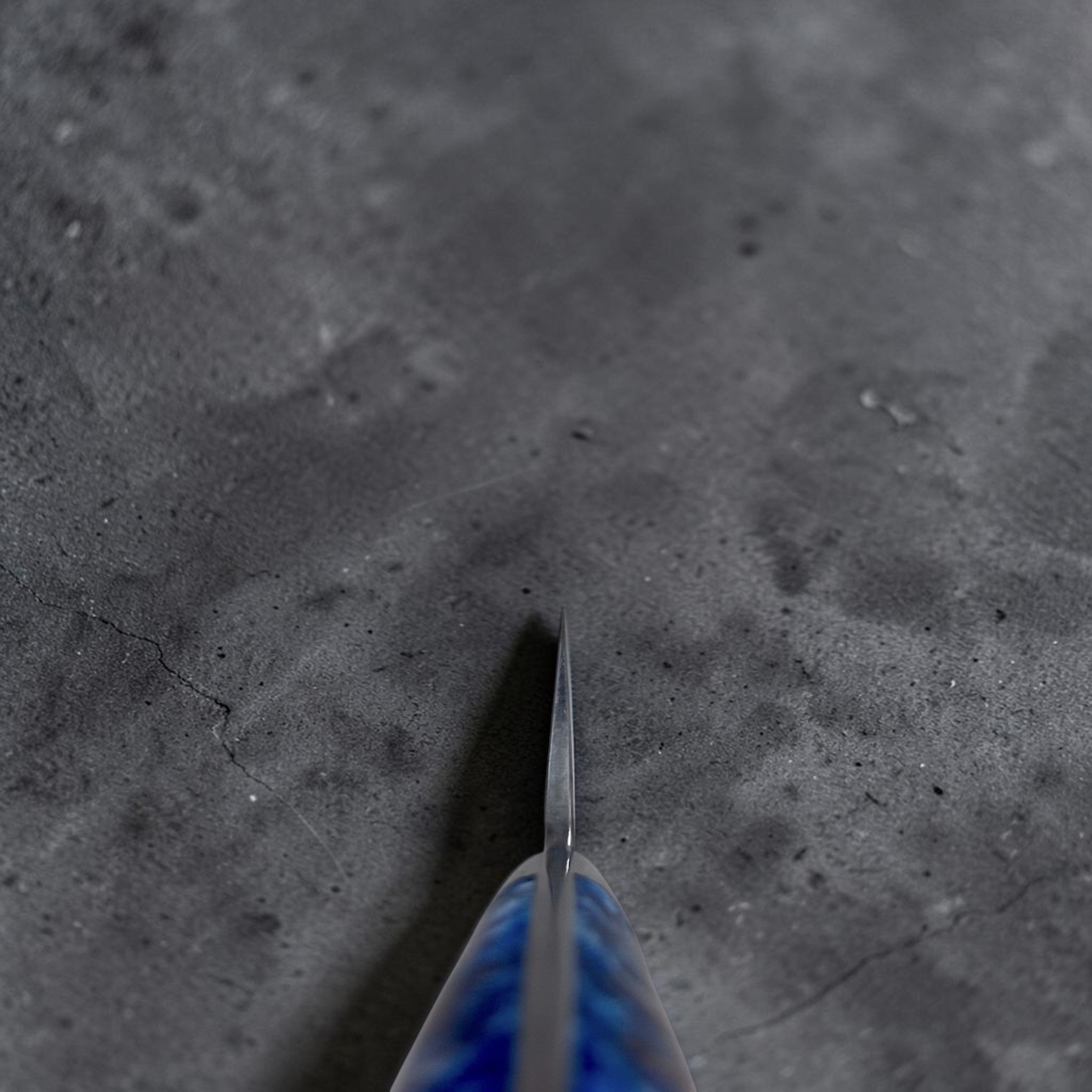 Takeshi Saji VG-10 Kuro Cross Tsuchime Sujihiki 240 mm with pinecone resin western handle, choil view showing thin blade geometry and the contoured western handle shape.