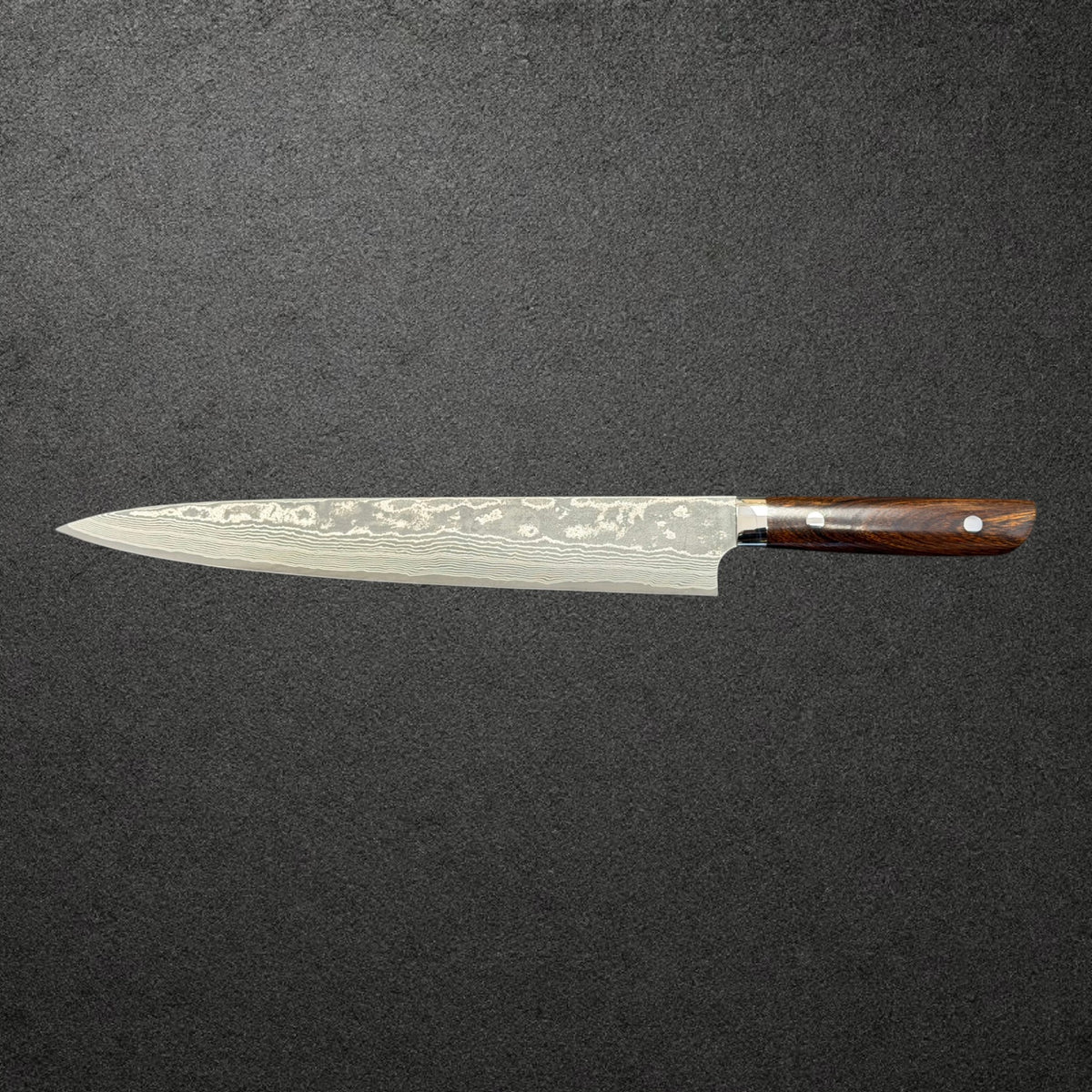 Reverse side profile of the Saji VG-10 Kurozome Sujihiki 270mm showing ironwood grain