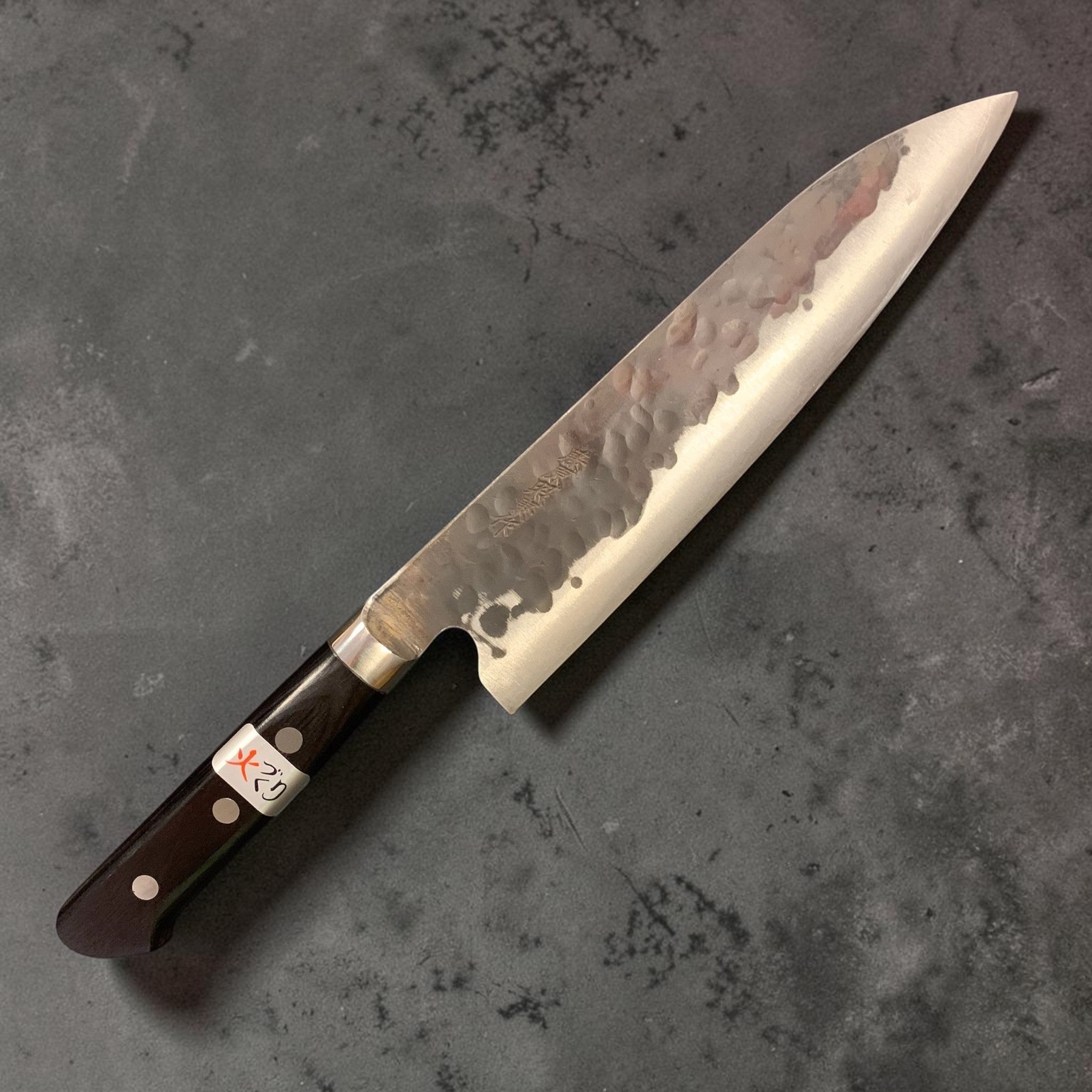 Teruyasu Fujiwara Denka Aogami Super Gyuto 195mm, full right-side view showing hammered kurouchi cladding and Western handle.