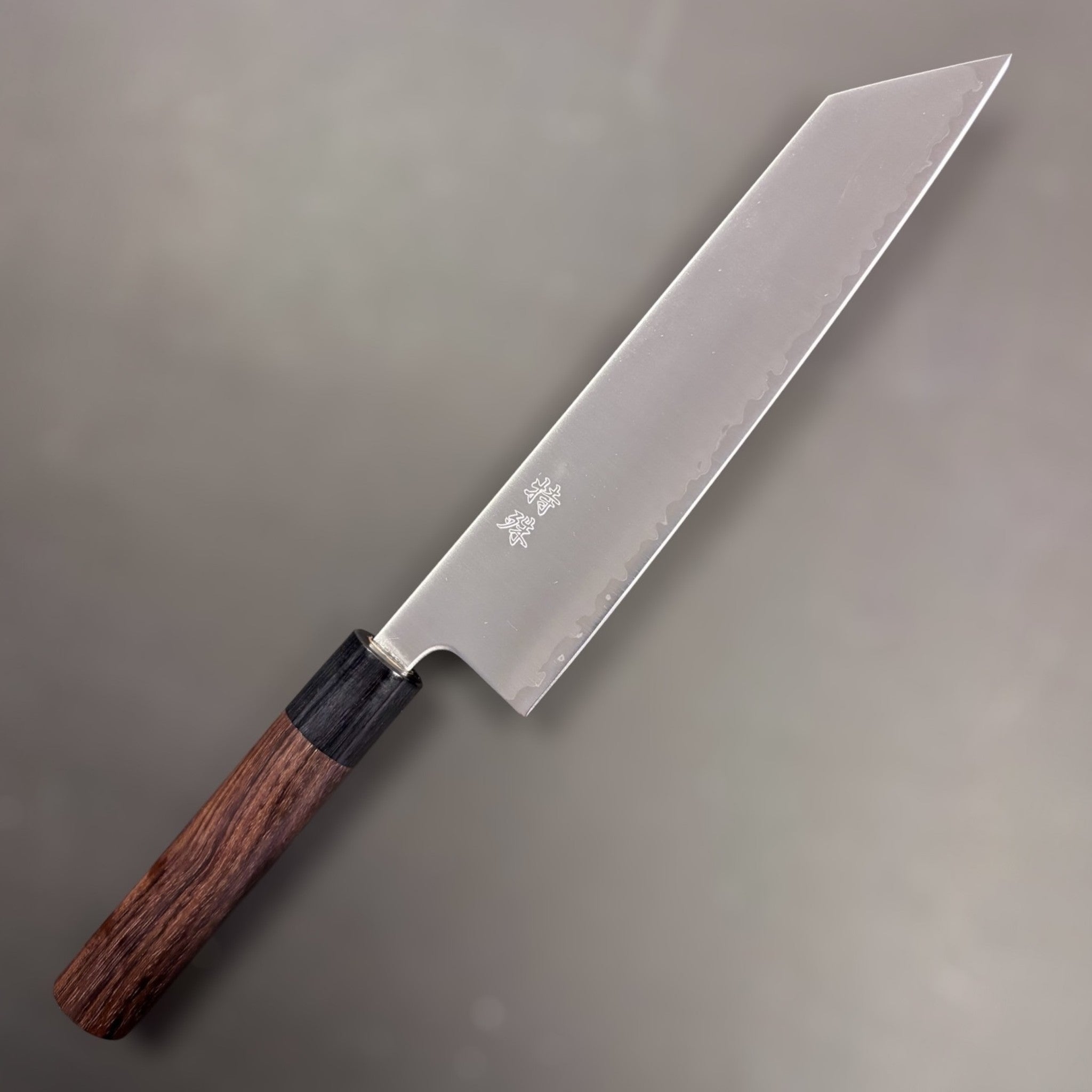Tokushu Knife Aogami Super Migaki Kiritsuke 210 mm, polished blade with crisp hamon line, side profile.