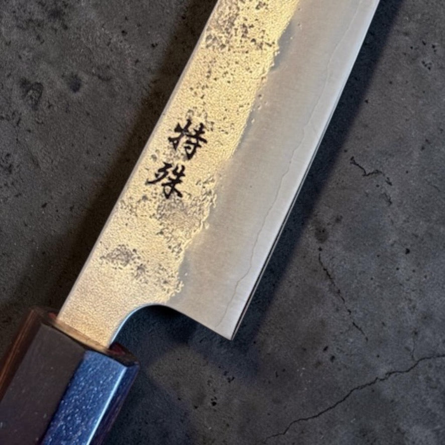 Close-up of Tokushu kanji, nashiji blade texture, grind, and ebony ferrule on the Ginsan #3 petty.