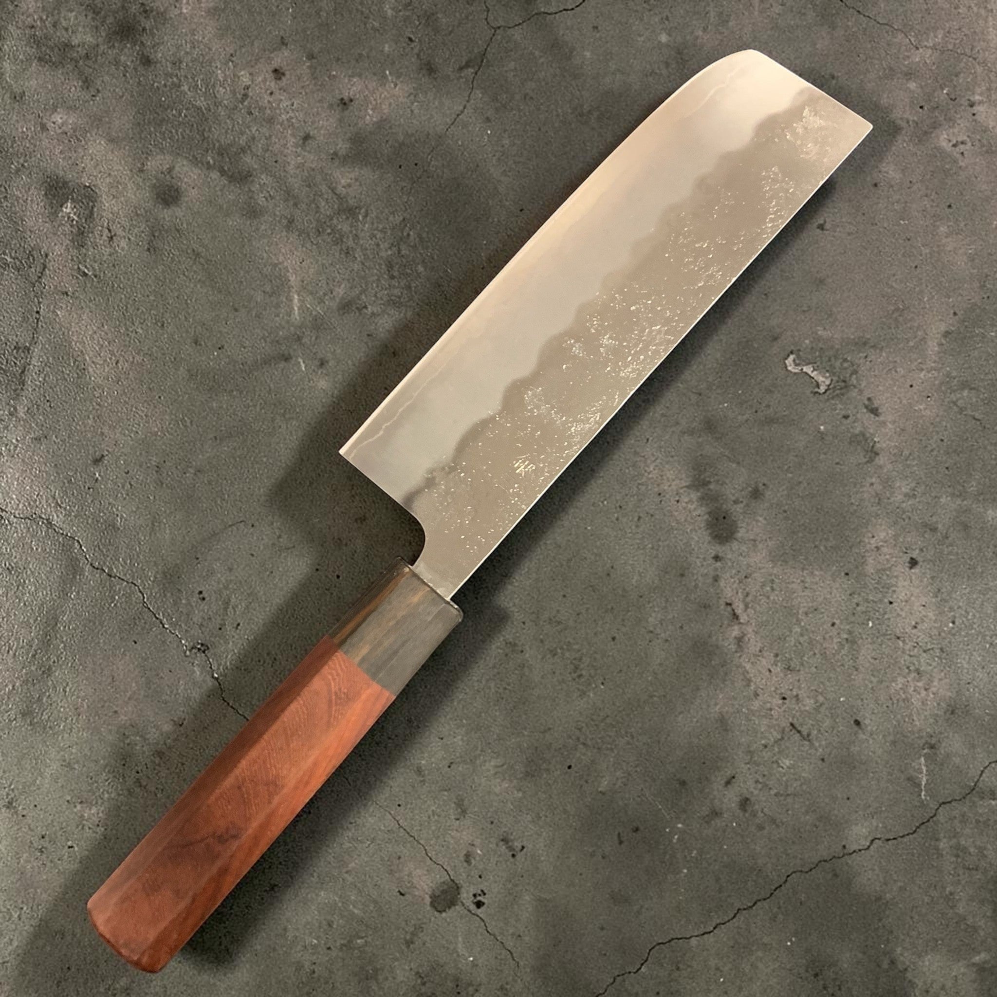 Tokushu Knife Ginsan #3 Nashiji Nakiri 165 mm, reverse side of blade showing Nashiji cladding and custom wa handle on black background.