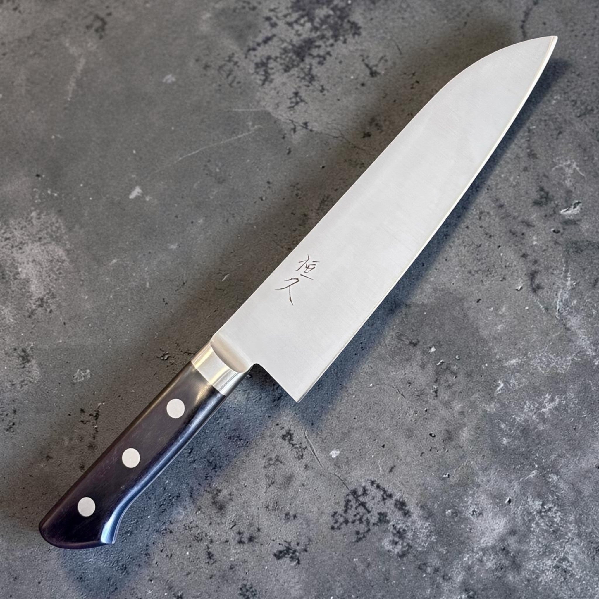 Tokushu Knife Tsunehisa Mono AUS-8 Santoku with black pakka wood western handle. Polished stainless steel blade.