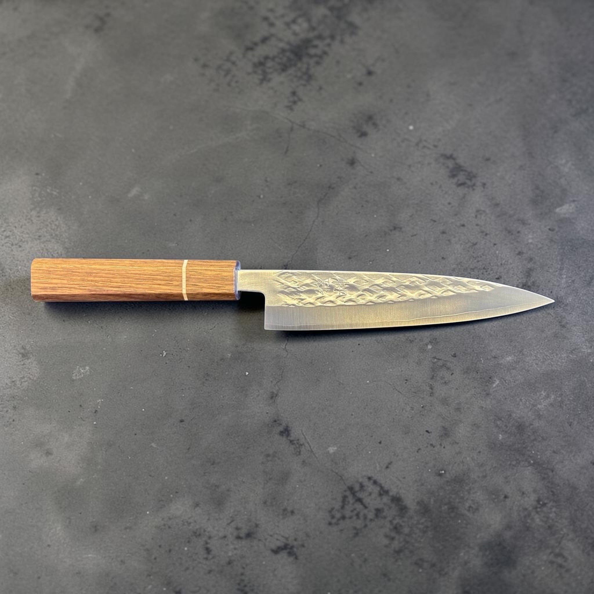 Tokushu Knife Tsuchime SLD 165 mm Hiraki Petty, full profile view showing the long petty blade, hammered tsuchime finish, and wood wa handle.