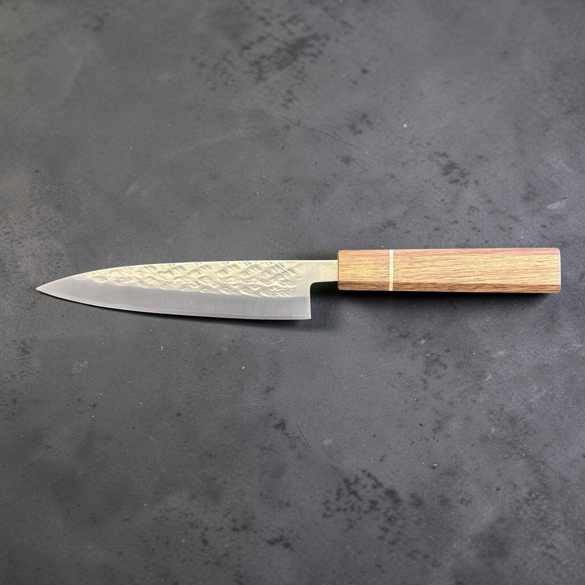 Tokushu Knife Tsuchime SLD 165 mm Hiraki Petty, reverse full profile view showing the slender petty profile and warm wood handle.