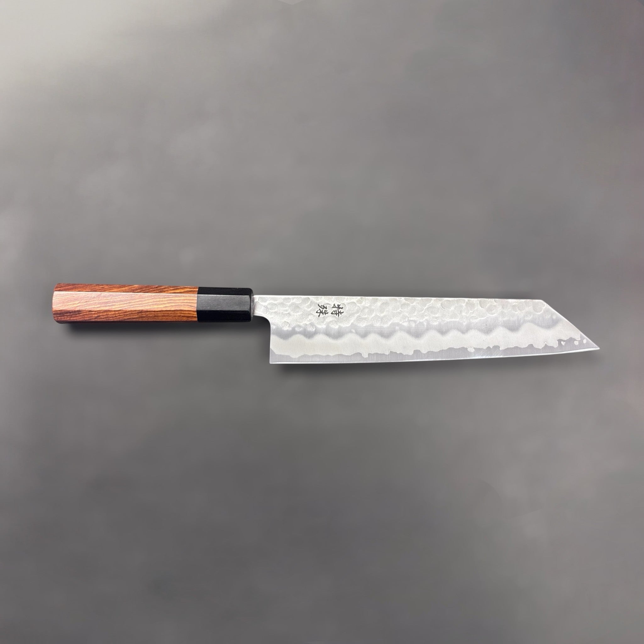 Tokushu White #2 Stainless Clad Tsuchime Kiritsuke 210mm, full-length profile on a grey background.