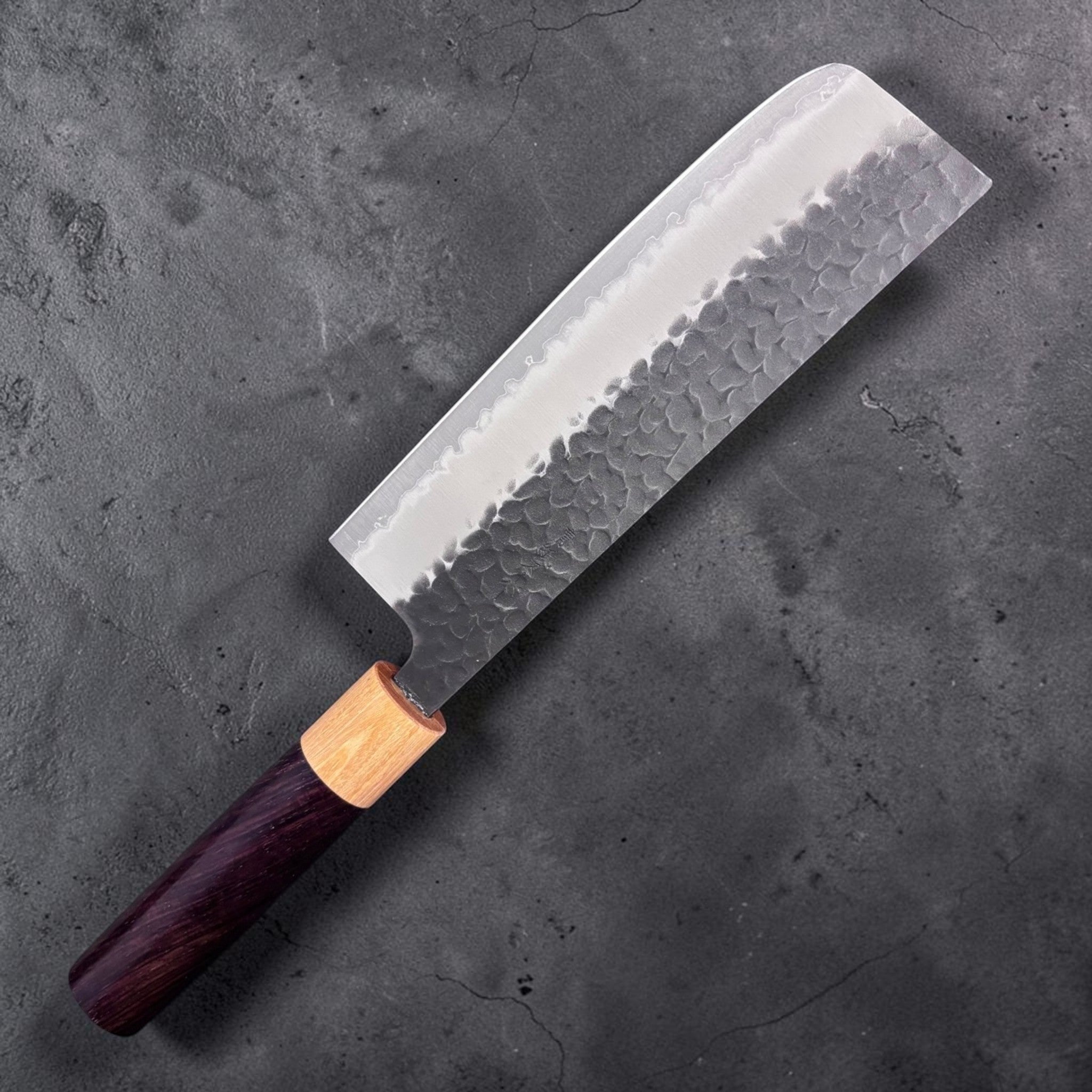 Tsunehisa Aogami Super Kurouchi Tsuchime Nakiri 165 mm, left-side face showing hammered kurouchi cladding and straight nakiri edge profile.