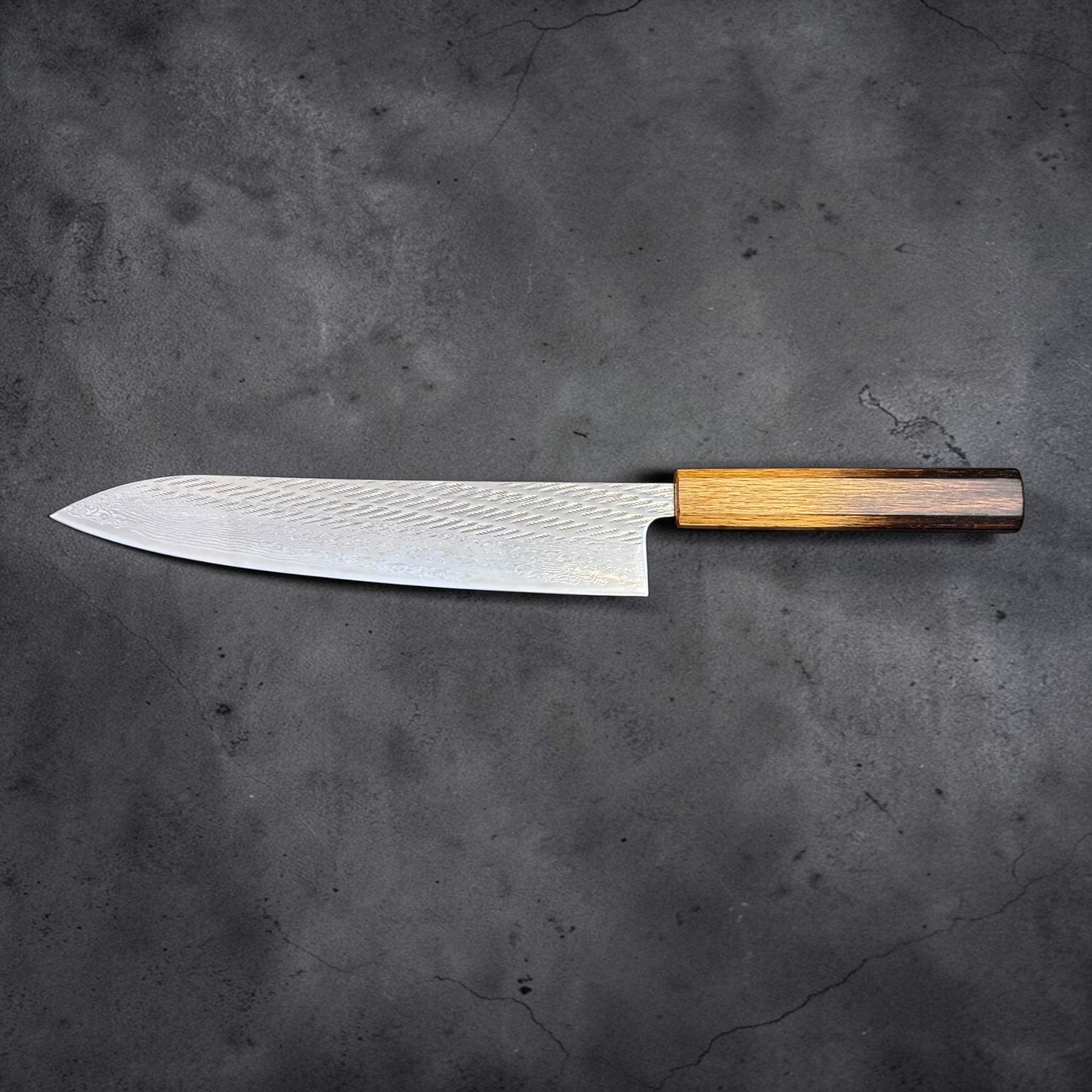 Tsunehisa AUS-10 Nawame Gyuto 240 mm with burnt oak handle, full profile view showing blade shape and handle geometry.
