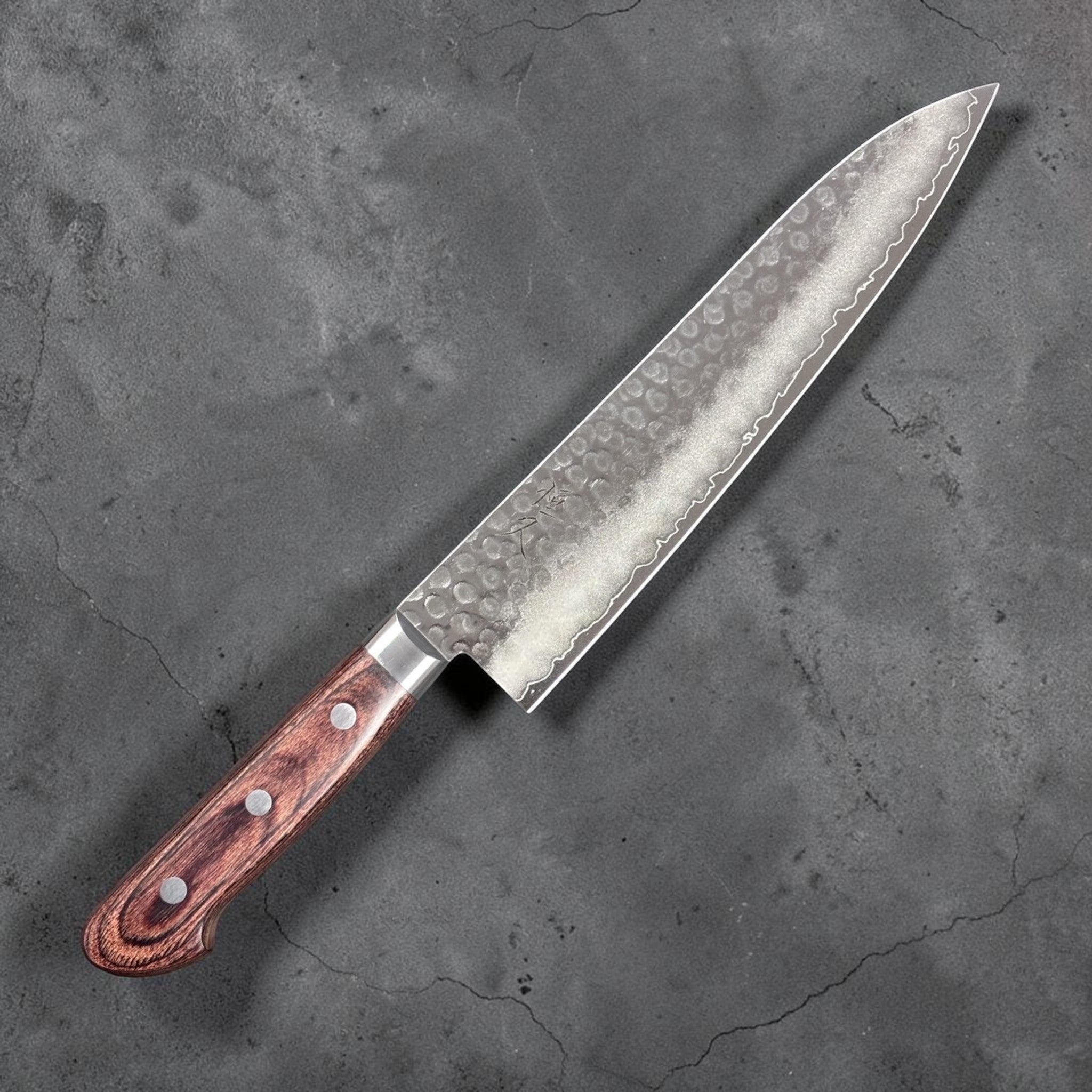 Tsunehisa VG-10 Tsuchime Gyuto 210 mm with brown Western handle, right-side face with hammered tsuchime texture and maker’s mark.