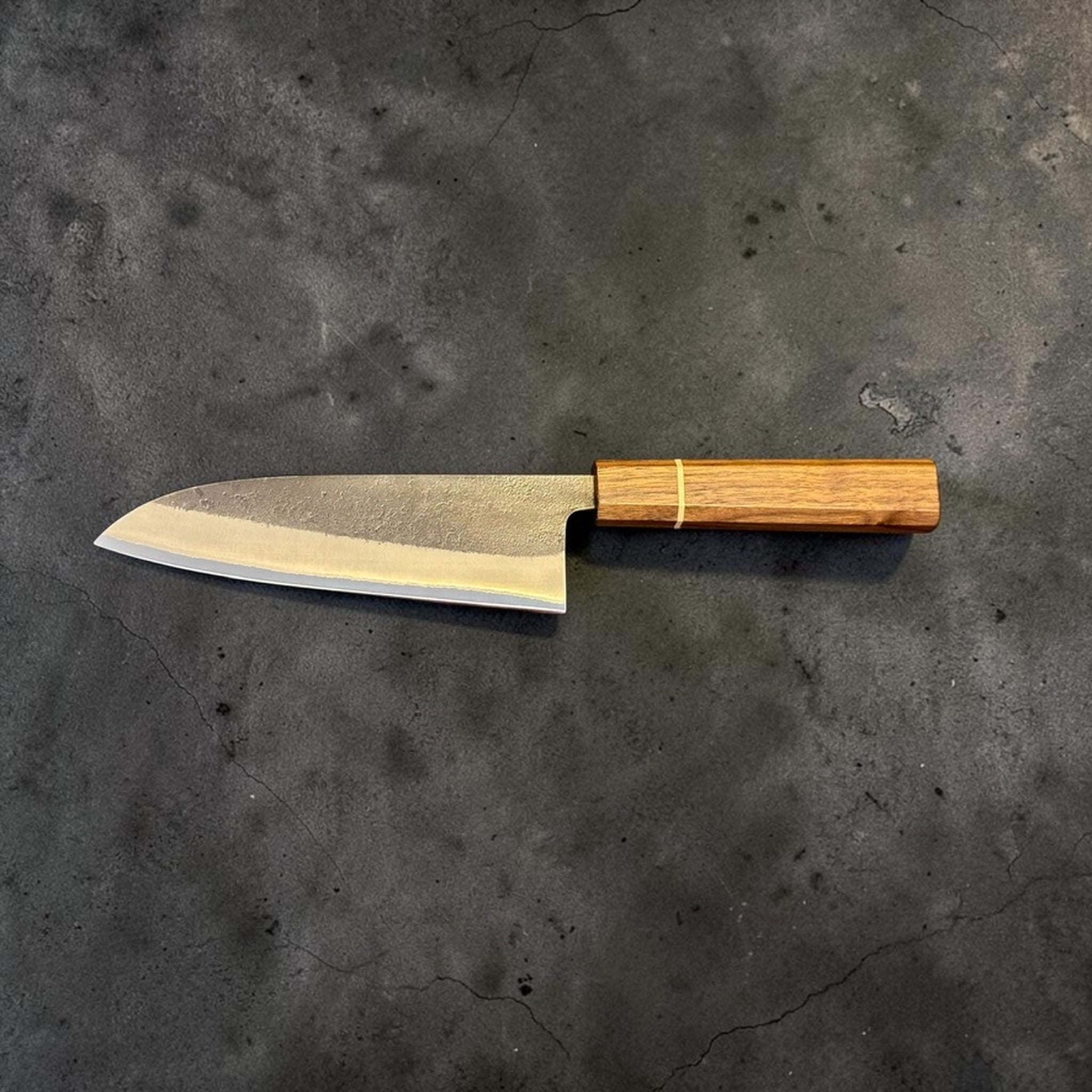 Yoshikane Nashiji Kurouchi Santoku with Sanjo walnut handle, reverse side profile view with the handle and blade in full view.