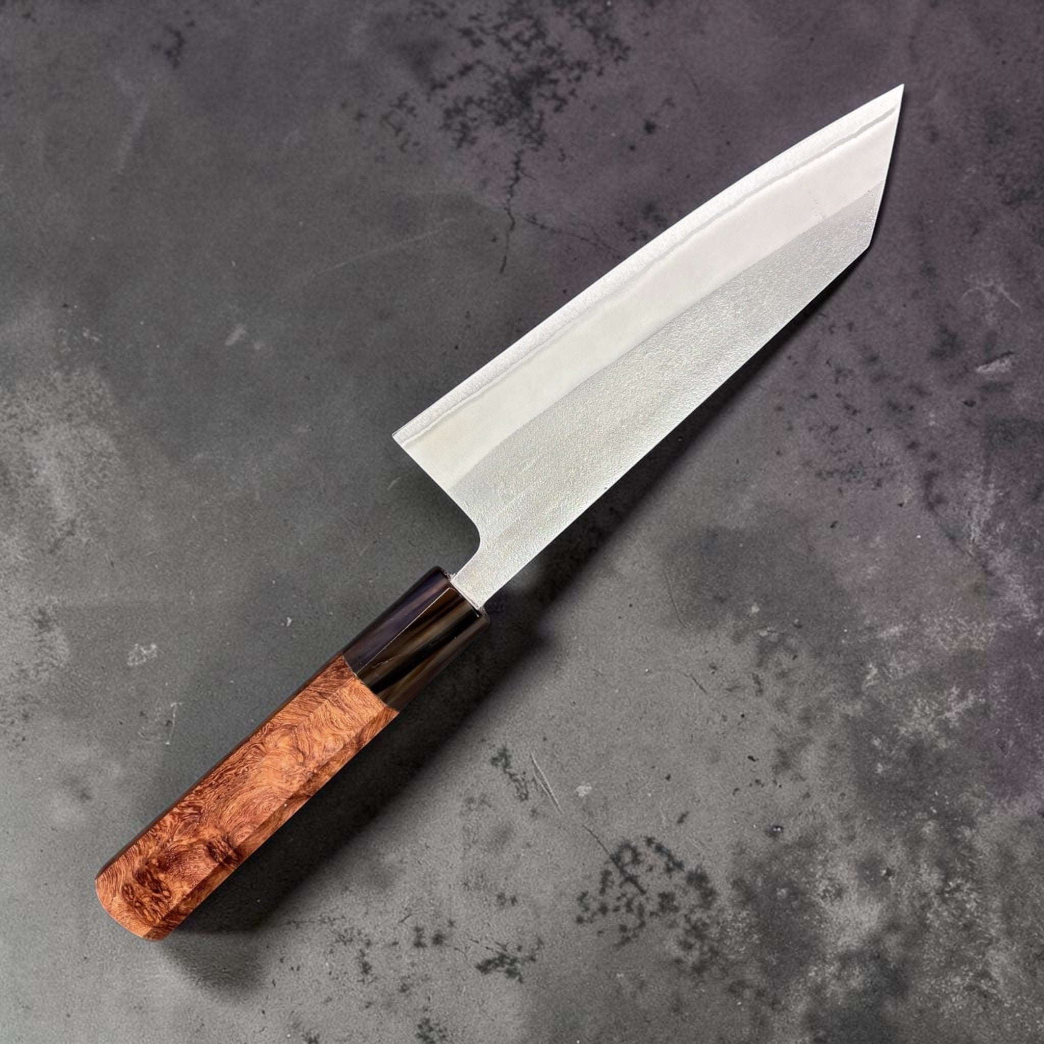 Yoshikane Nashiji White #2 Bunka 165 mm knife showing spine thickness and distal taper, amboyna burl handle, on white background.