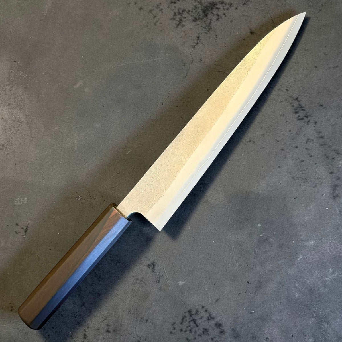 Yoshikane SKD Nashiji Gyuto 240mm mono ebony handle variant with nashiji blade finish.