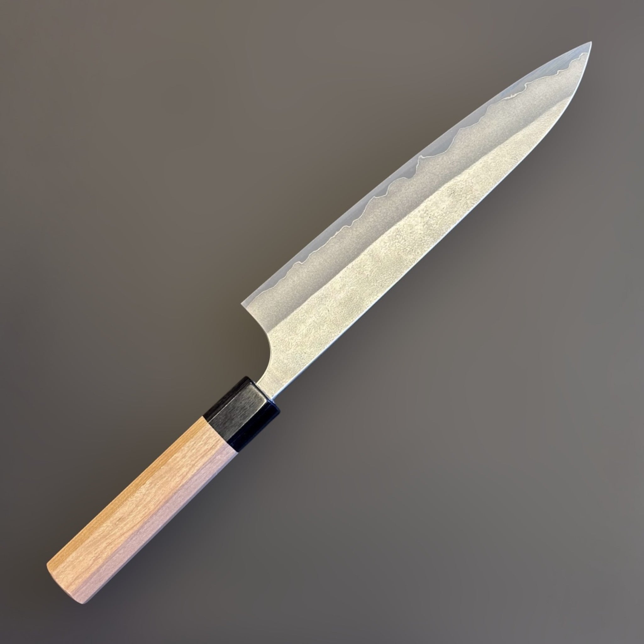 Yoshimi Kato Aogami Super Nashiji Gyuto 210 mm, left sided angled close-up showing Nashiji finish and blade profile.