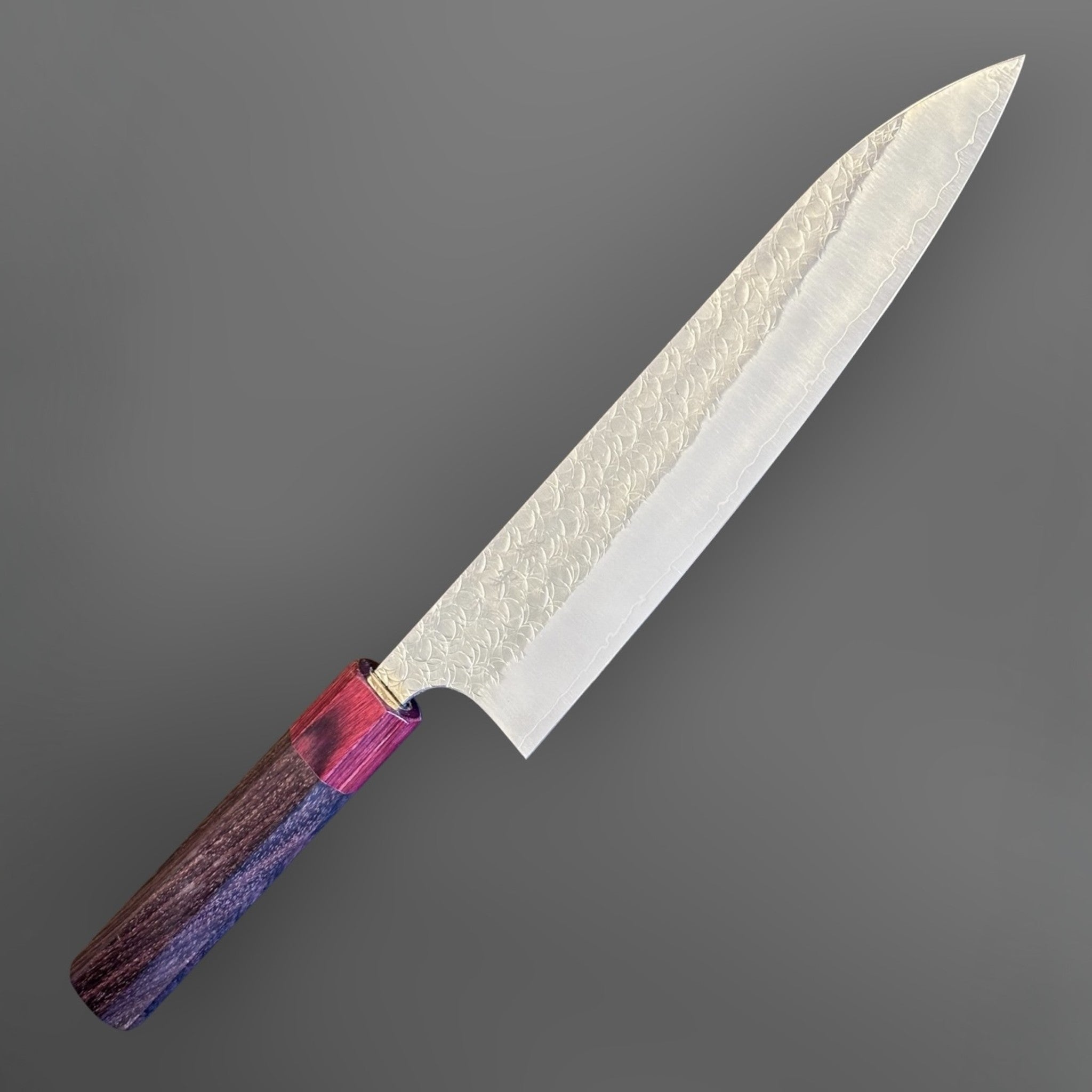 Yoshimi Kato Minamo SG2 Gyuto 210 mm, angled view highlighting the polished blade and red handle ferrule.