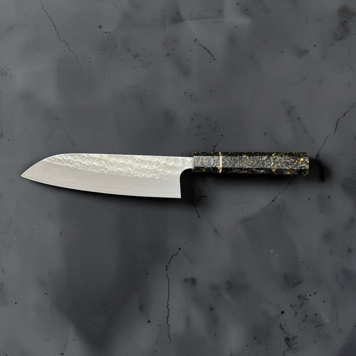 Reverse side profile of the Yoshimi Kato Minamo SG2 santoku with its carbon fiber gold-fleck octagonal handle on the right.