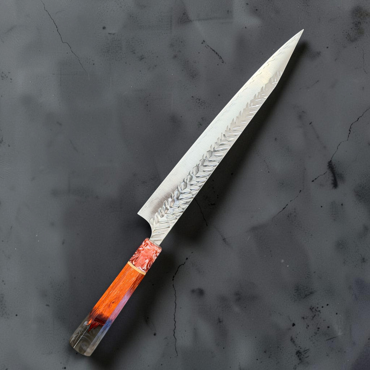 Angled reverse view of Yoshimi Kato SG-STRIX 270mm kiritsuke sujihiki showing the V-shaped hammered finish and Prisma handle.