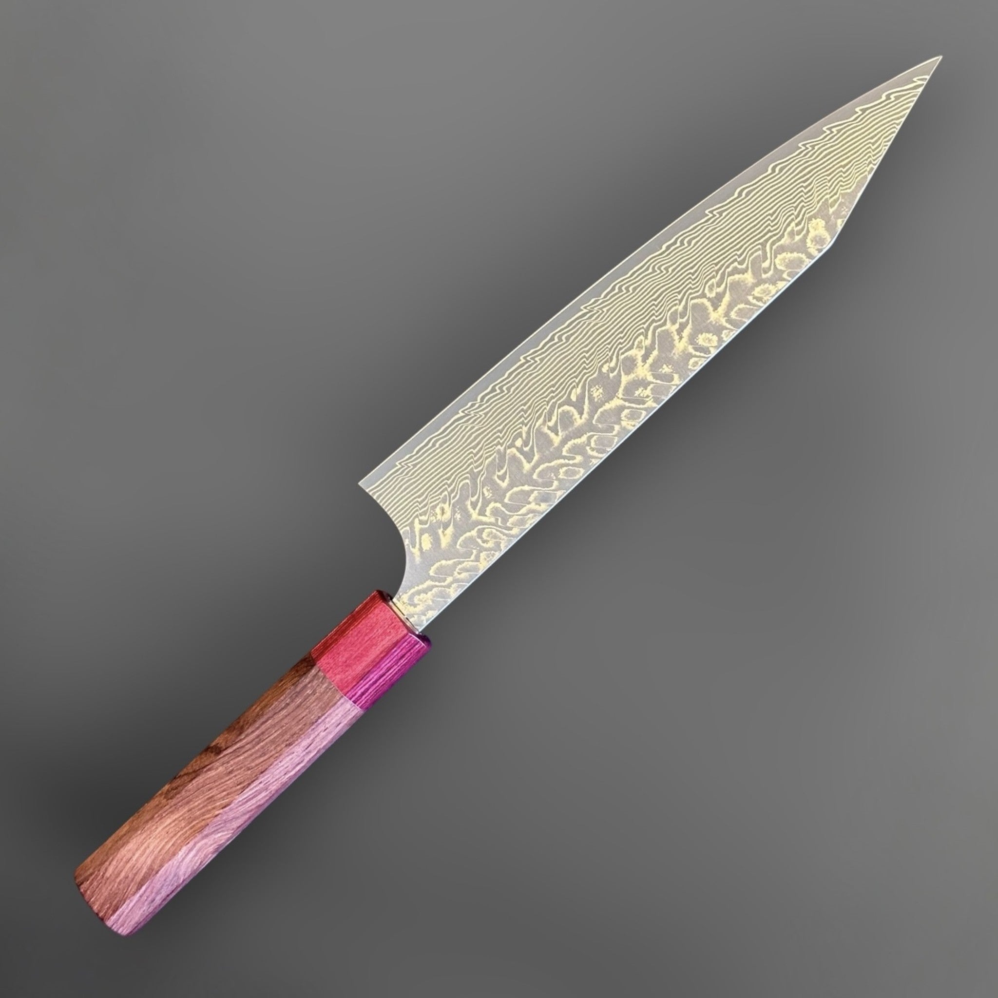 Yoshimi Kato SG2 Kuro Damascus Kiritsuke 210 mm with Honduran wood handle, angled full-profile view showing the Damascus blade pattern.