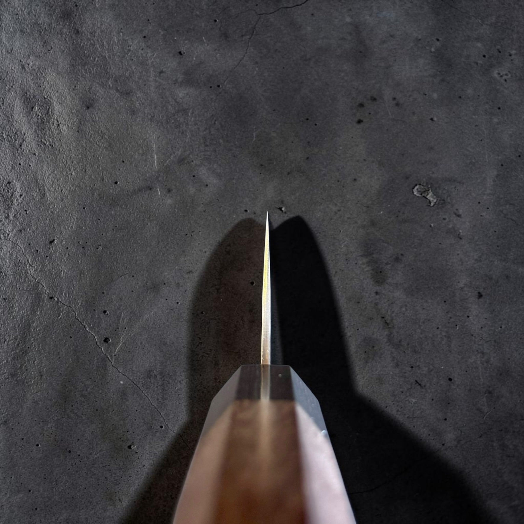 Yu Kurosaki Kokusen AS Bunka 165mm choil view showing the thin grind and rosewood octagon wa handle