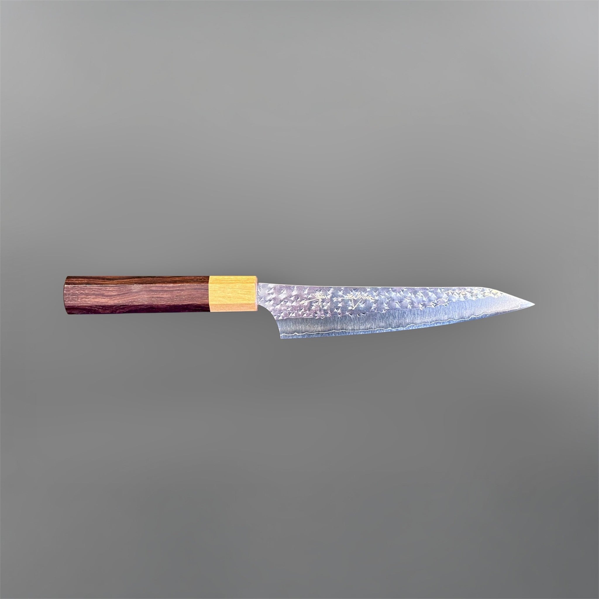 Yu Kurosaki Senko Ei SG2 Petty 150 mm with rosewood octagonal handle, side profile view showing the pointed petty blade.