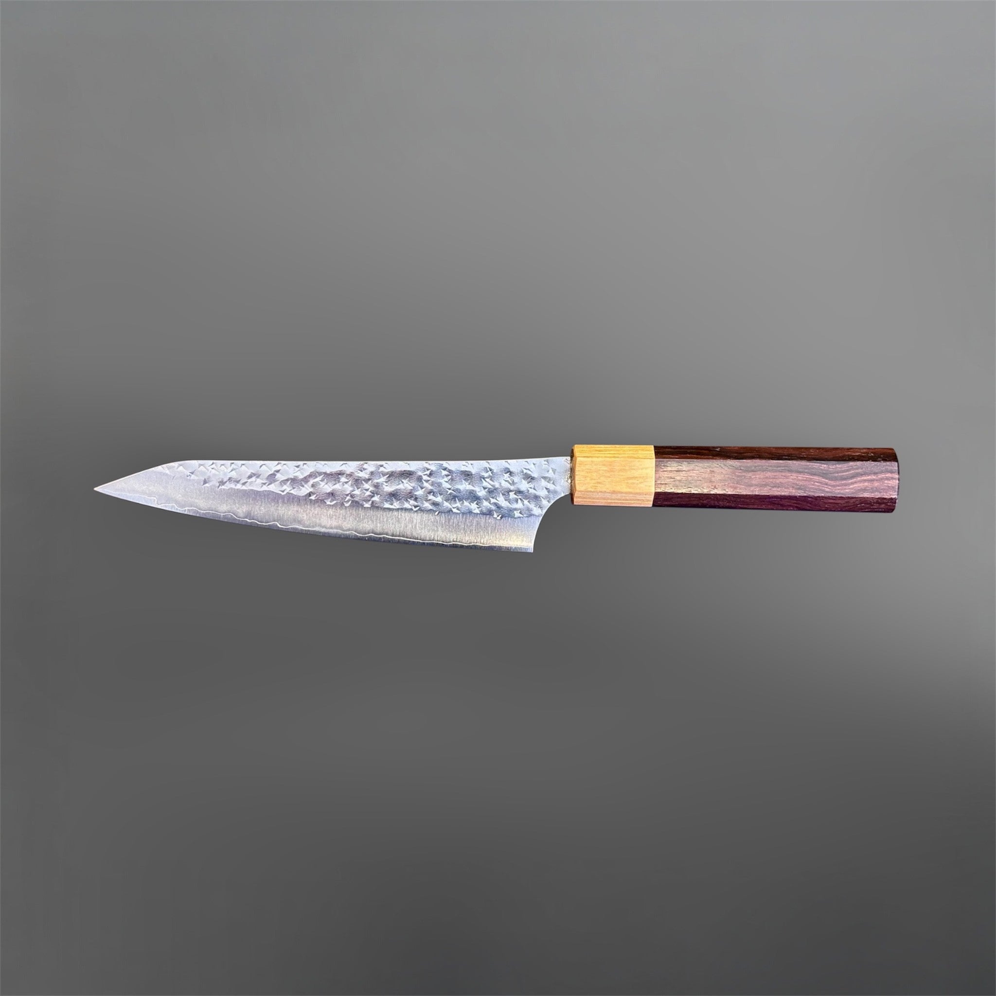 Yu Kurosaki Senko Ei SG2 Petty 150 mm with rosewood octagonal handle, reverse side profile on gray background.