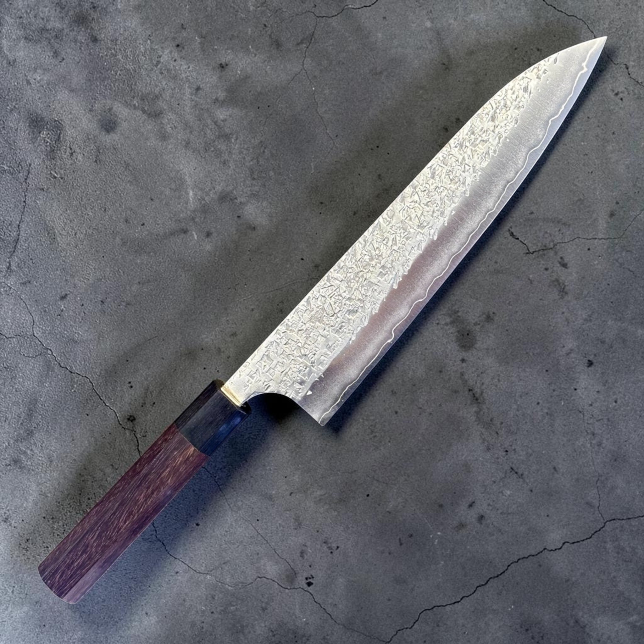 Yu Kurosaki Shizuku SG2 Gyuto 210 mm with rosewood octagonal handle, full knife angled product photo showing hammered Shizuku blade finish and rosewood handle.