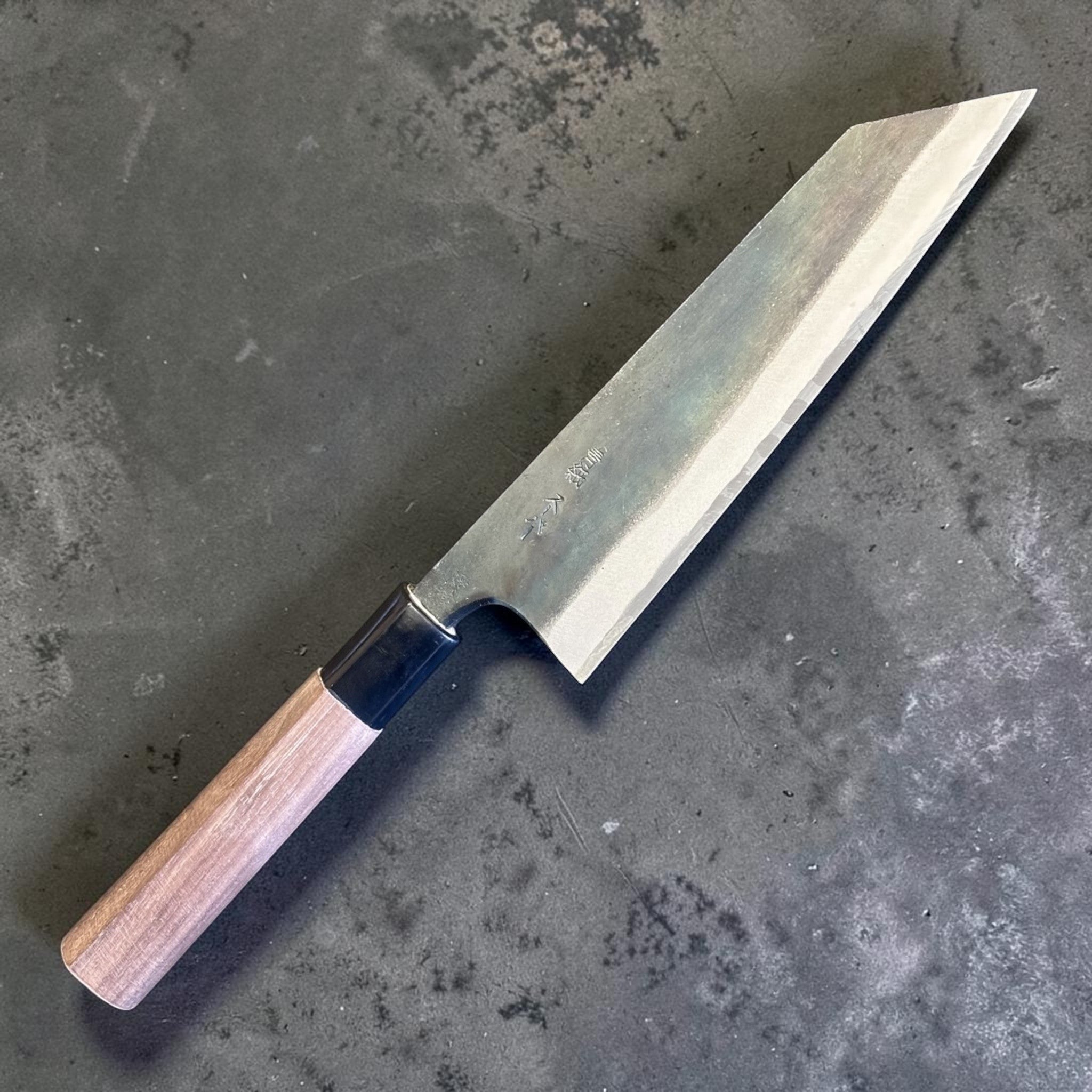 Zakuri AS Kurouchi Bunka 165 mm with kurouchi finish and wa handle, angled blade view showing the kurouchi finish.