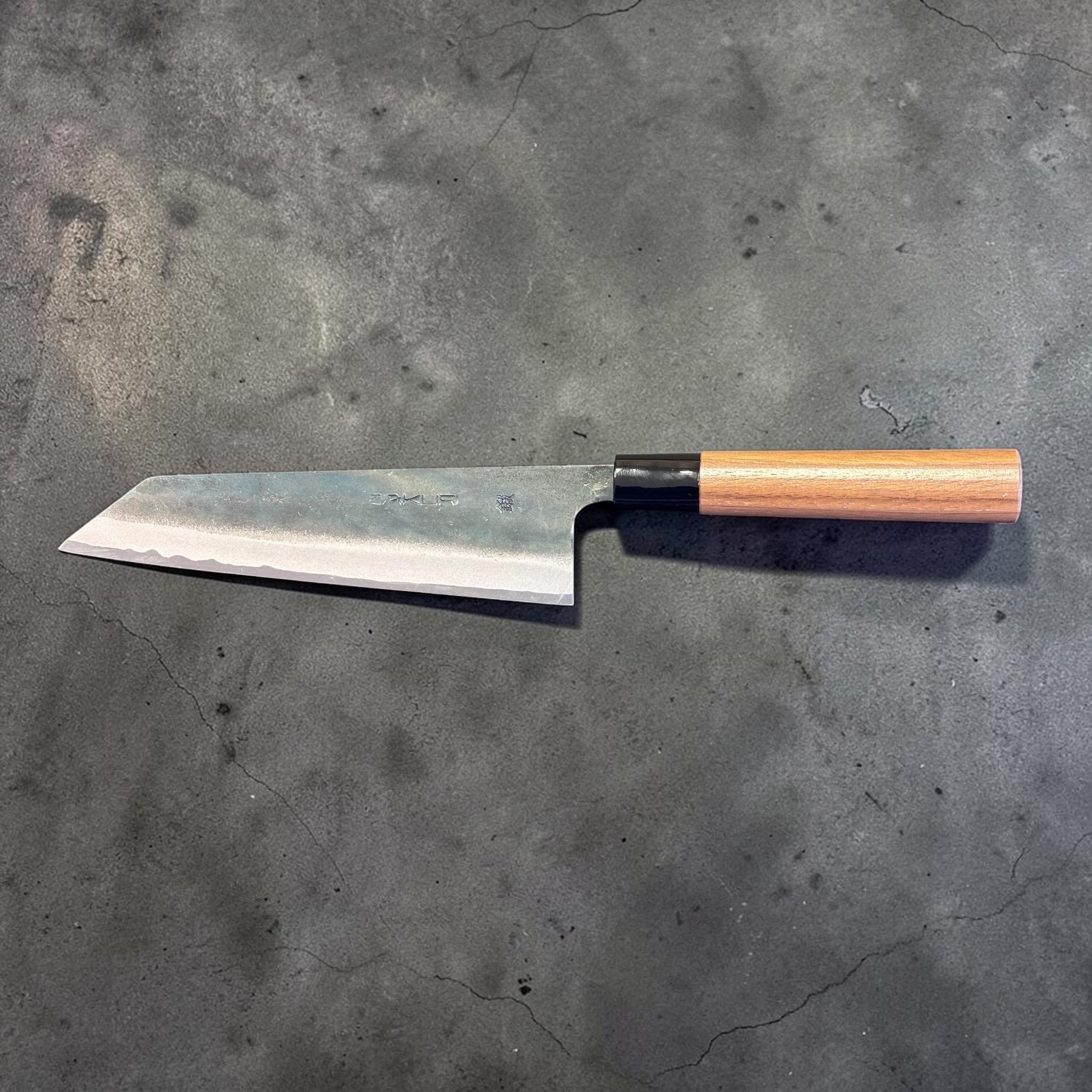 Zakuri AS Kurouchi Bunka 180 mm with kurouchi finish and wa handle, side profile product photo showing blade shape and handle.