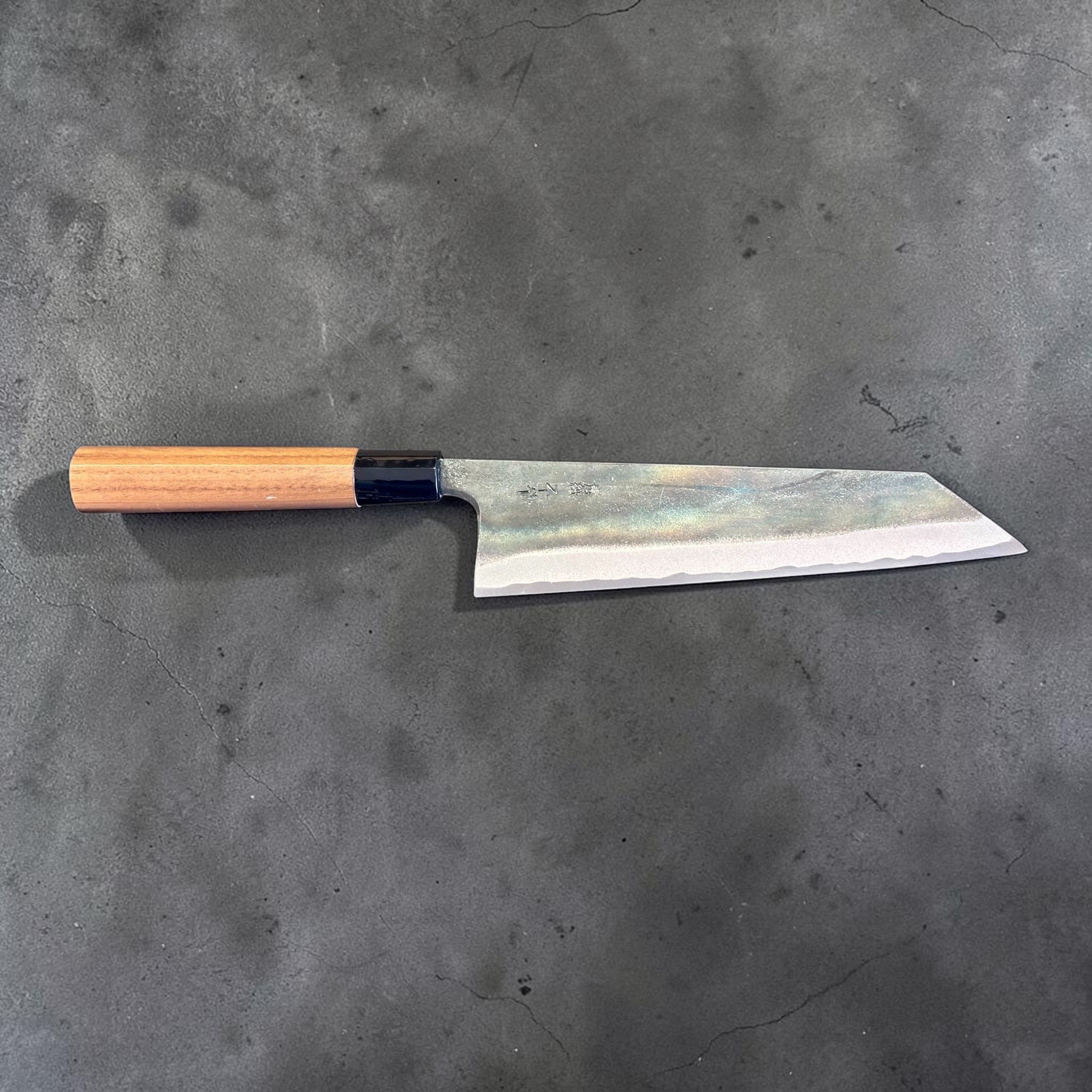 Zakuri AS Kurouchi Bunka 180 mm with kurouchi finish and wa handle, side profile product photo showing blade shape and handle.