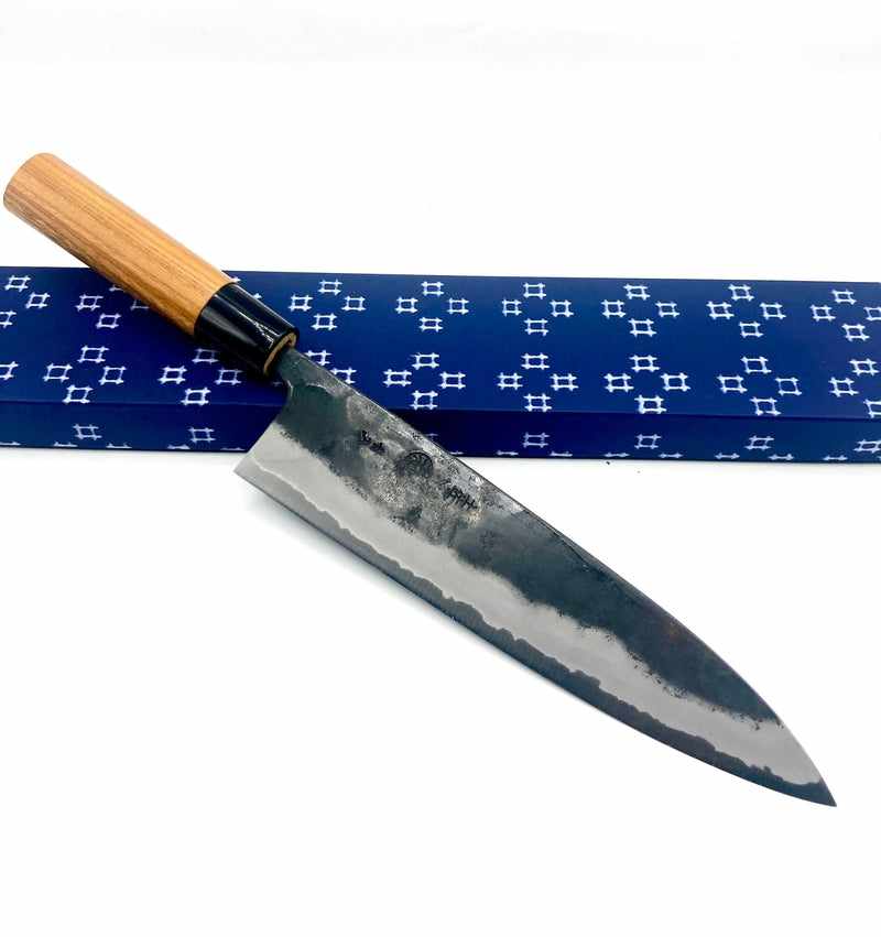 http://tokushuknife.com/cdn/shop/products/kyohei-shindo-blue-2-iron-clad-kurouchi-210mm-gyuto-101142.jpg?v=1702910376