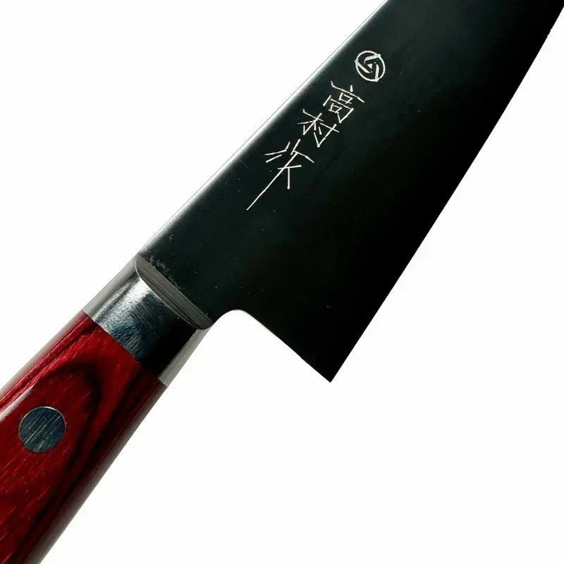 Takamura Knife showing kanji shining in the light