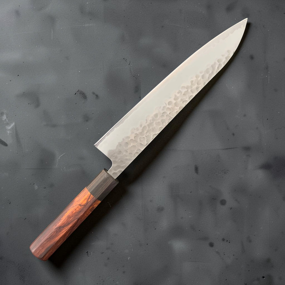 Reverse side of the Tokushu White #2 240mm gyuto showing hammered stainless cladding