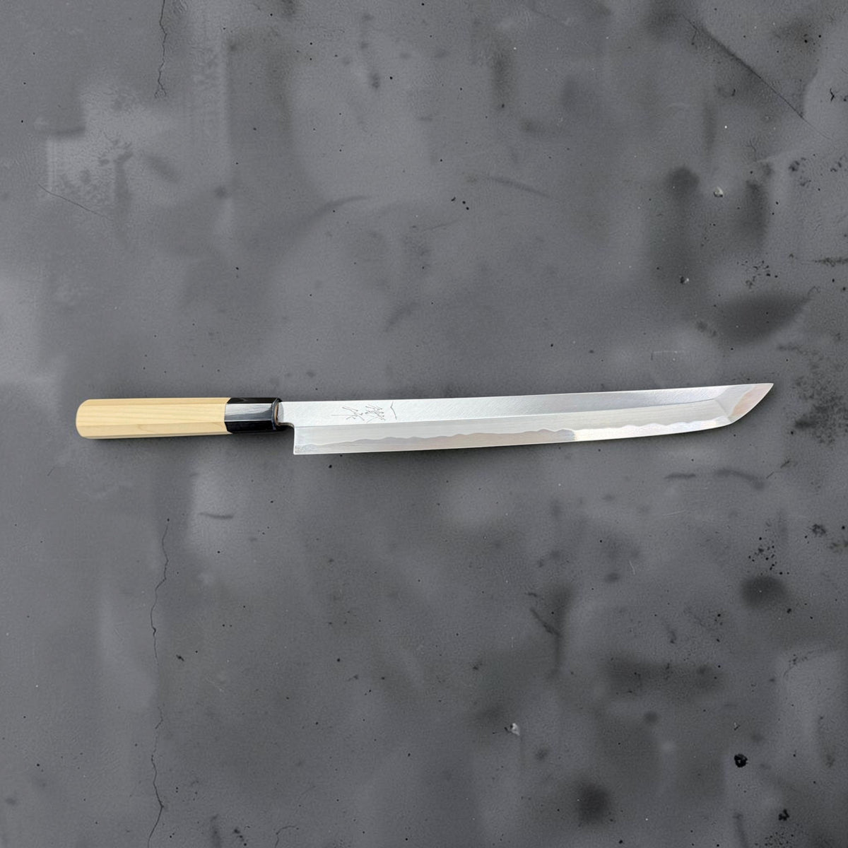 Full bevel-side profile of Yoshikazu Tanaka White #2 sakimaru yanagiba with curved tip