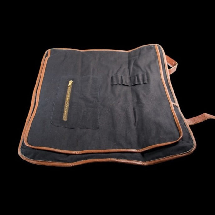 Canvas knife roll by Tokushu Knife showing flap that protects knives. 