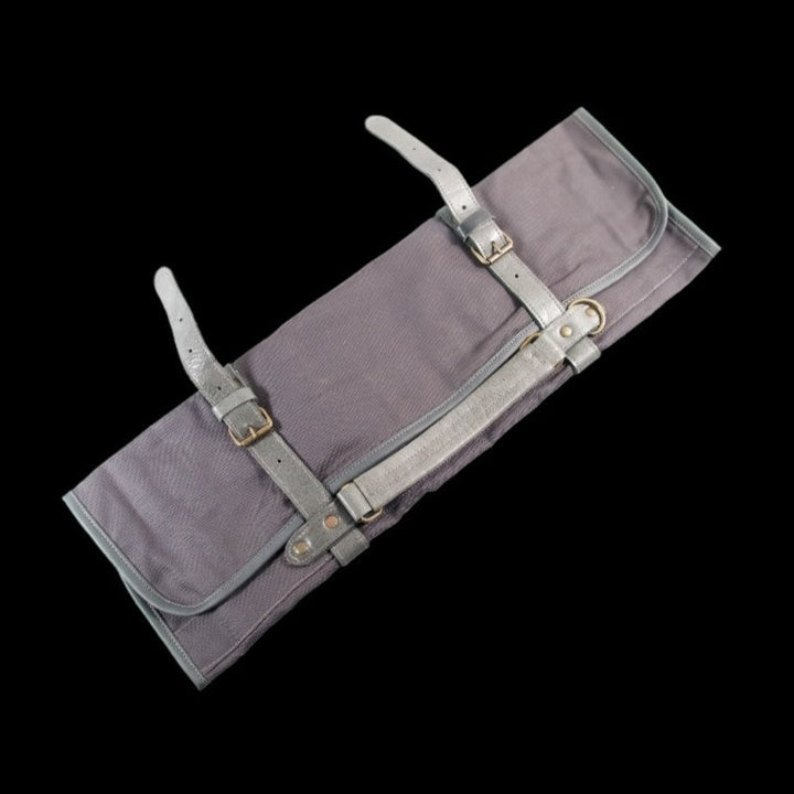 Blue canvas knife roll with grey leather straps