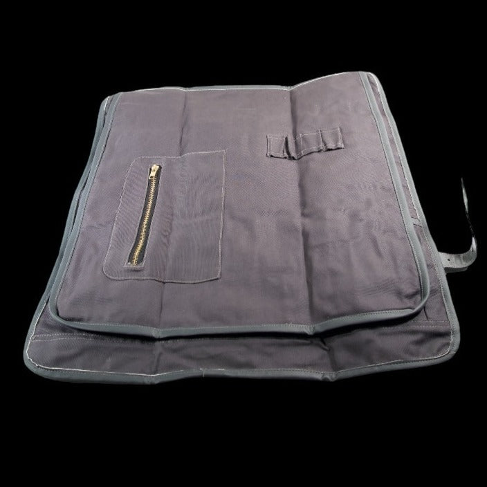 Canvas knife roll in blue and grey leather showing protective flap