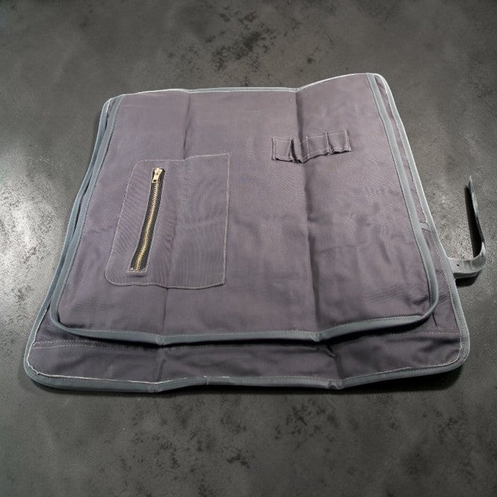 Canvas knife roll in blue and grey leather showing protective flap