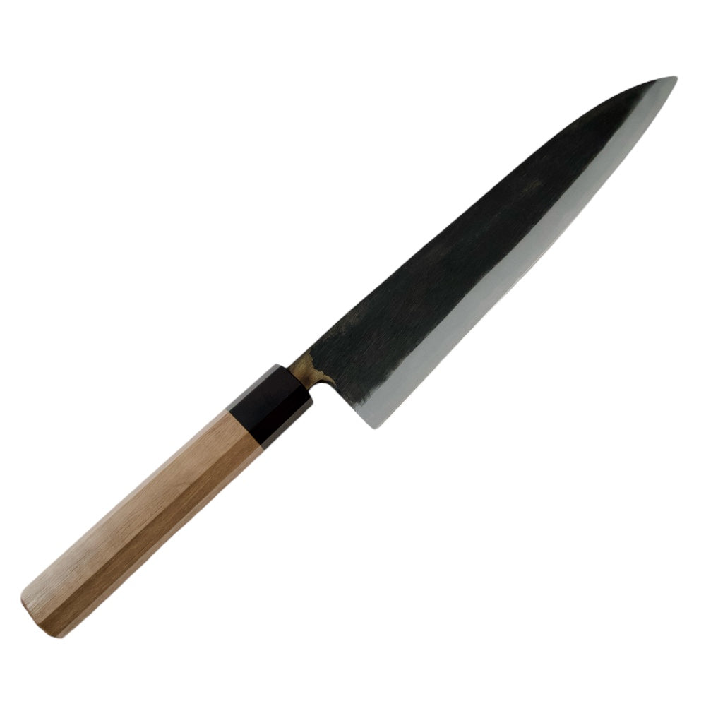 Moritaka 240mm gyuto knife on a black background.