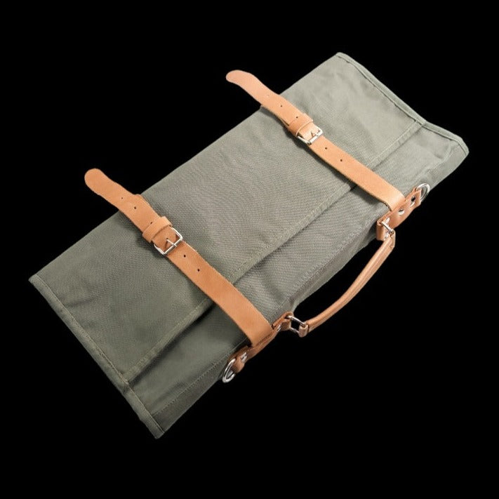 Olive canvas knife roll with tan straps