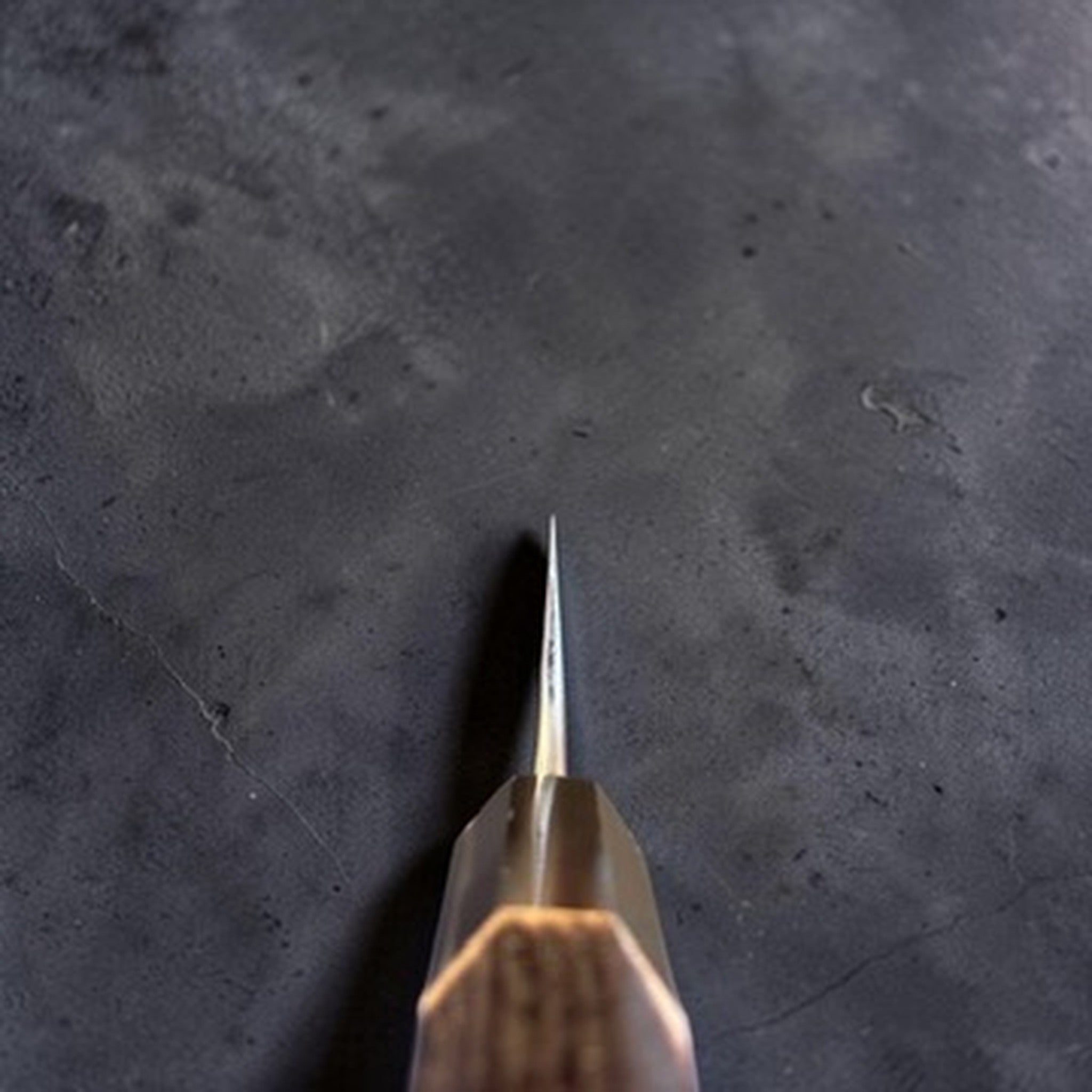Anryu AO #2 Kurouchi Tsuchime Petty 150 mm, choil view showing thin grind and handle alignment.