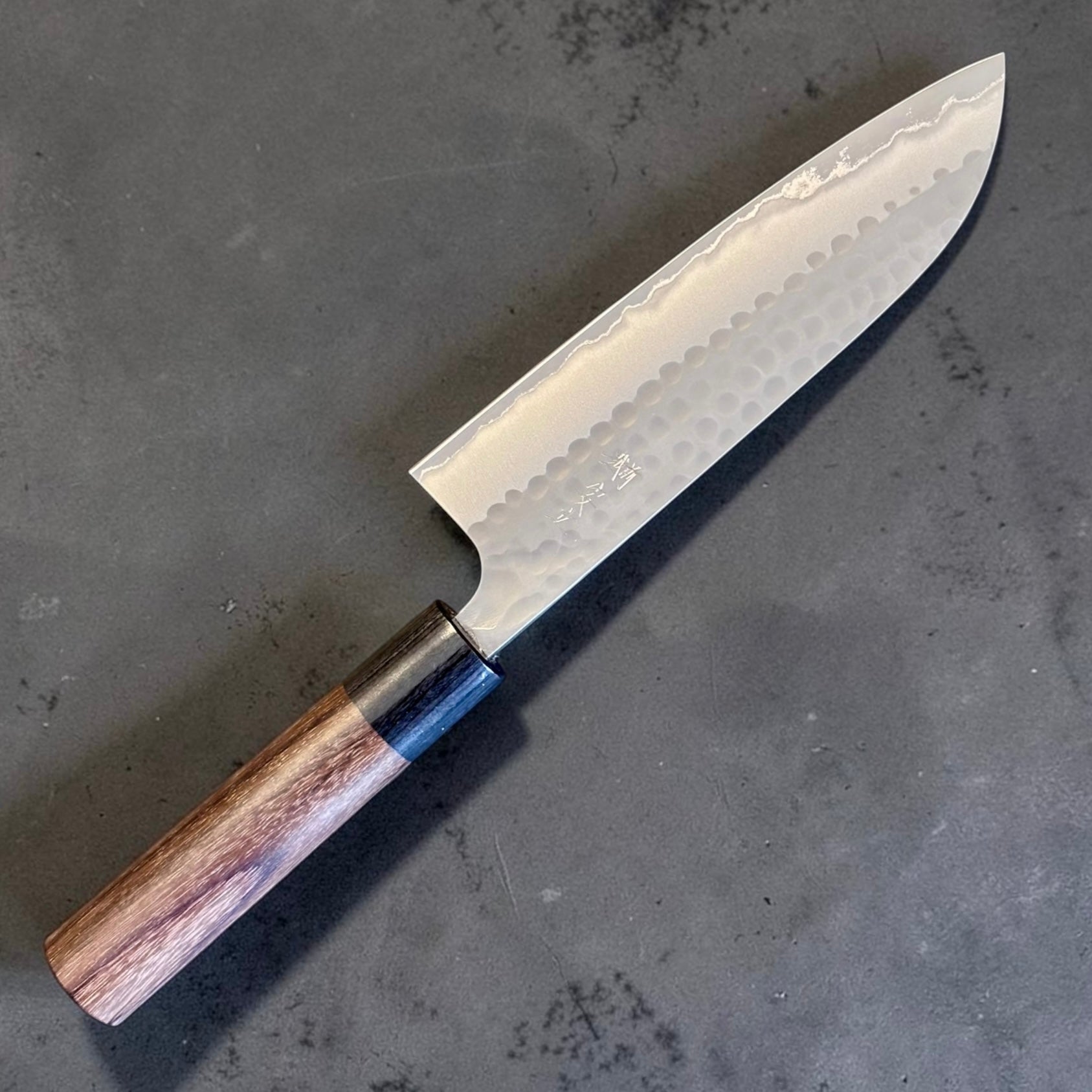 Anryu Aogami #2 Tsuchime Santoku 165mm with rosewood wa handle and black ferrule, angled full view